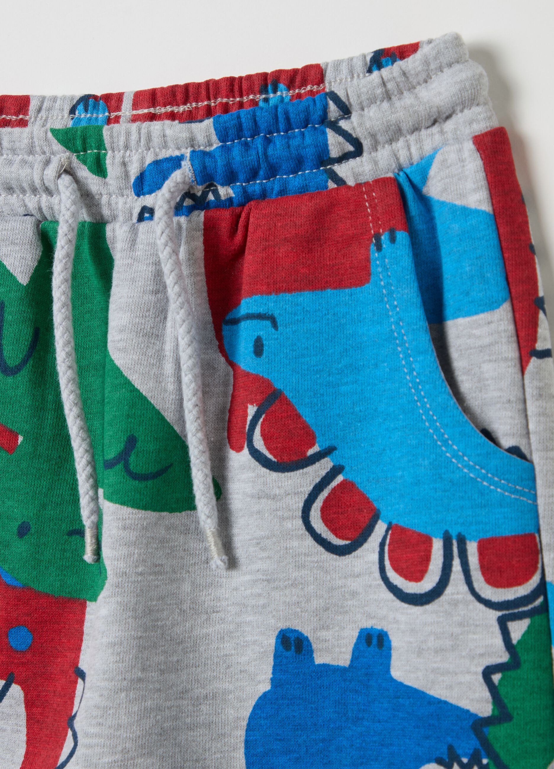 Joggers with all-over dinosaurs print