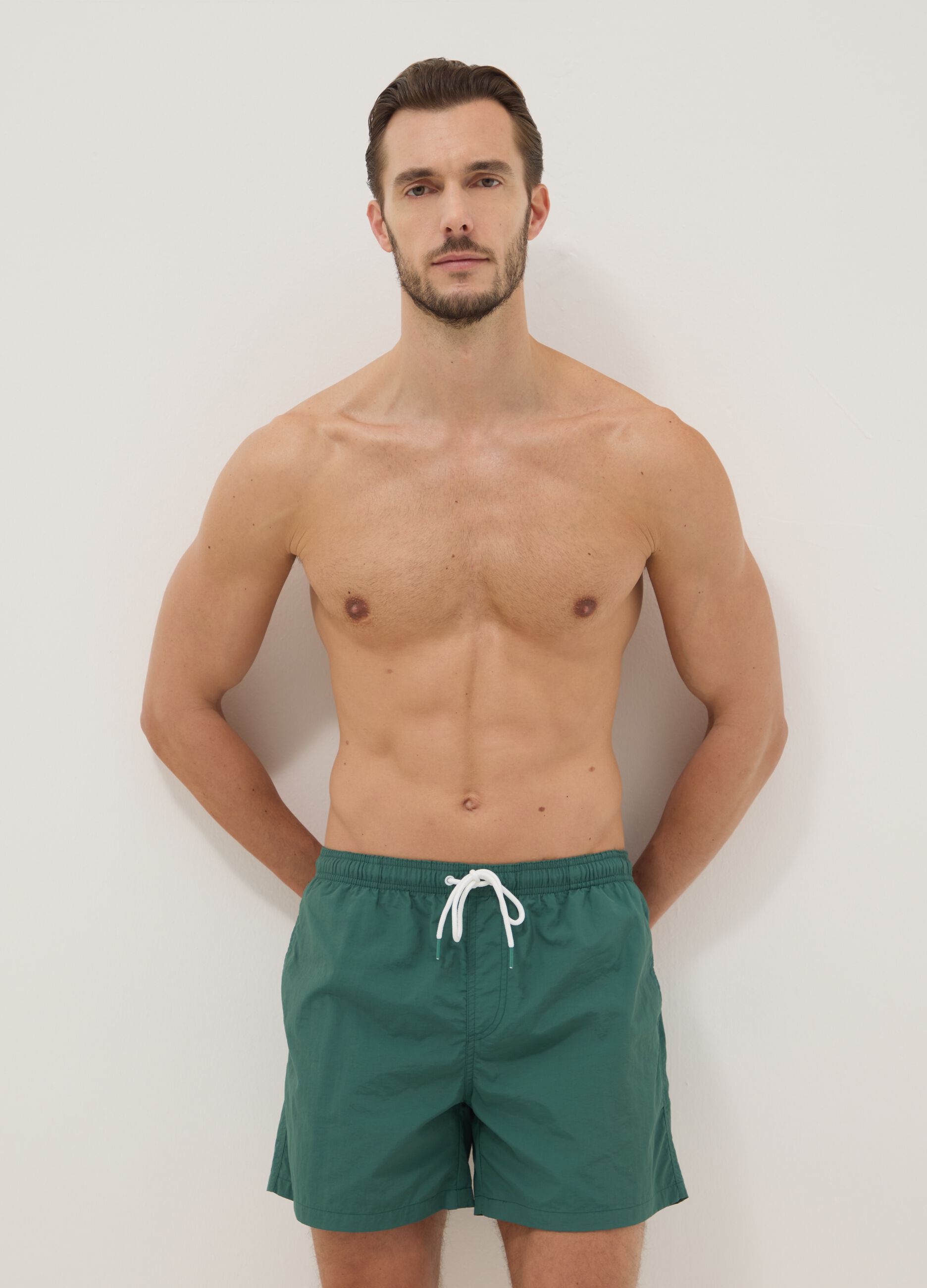 Green swim shorts with elasticated waist
