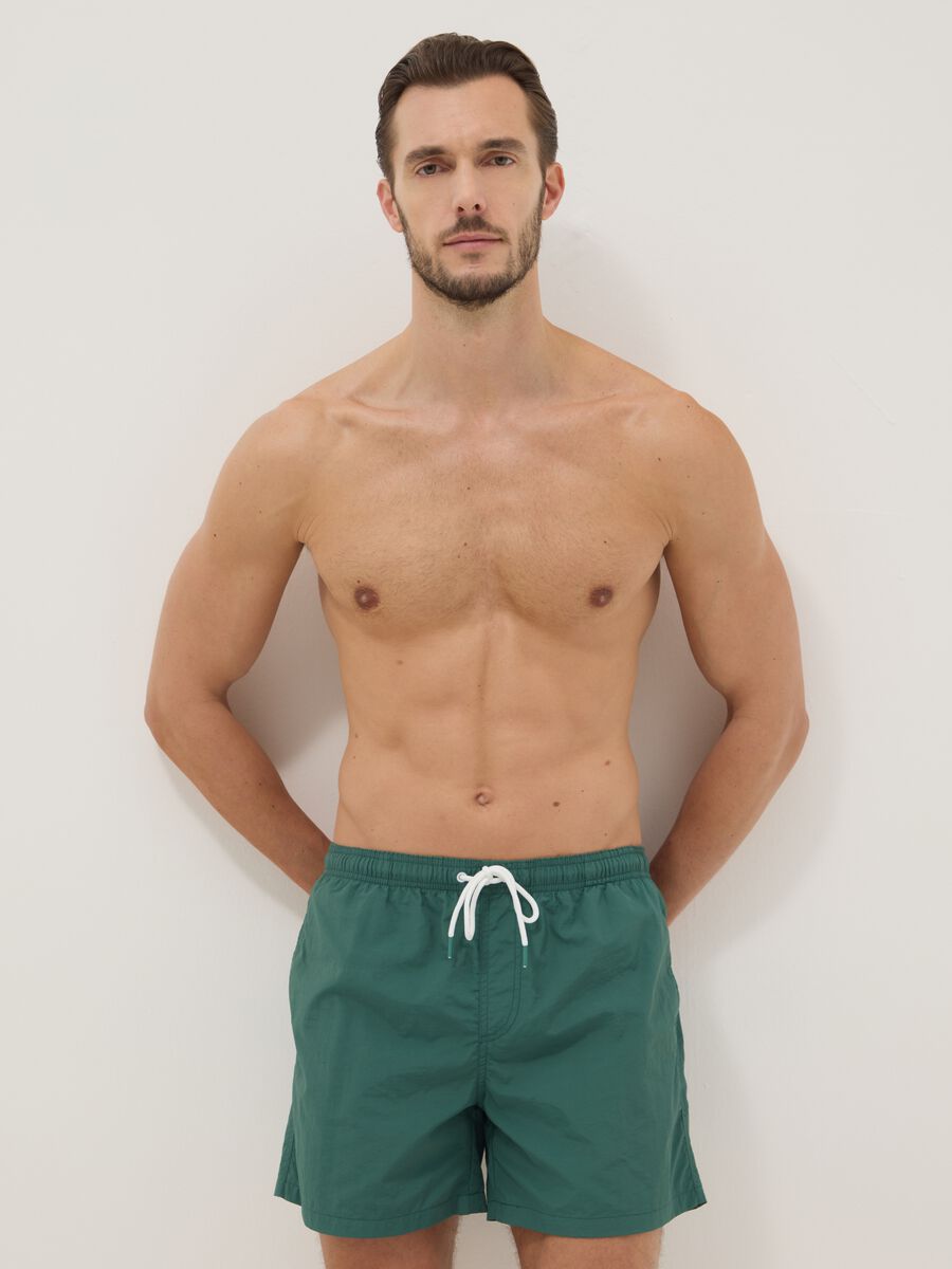Green swim shorts with elasticated waist_0