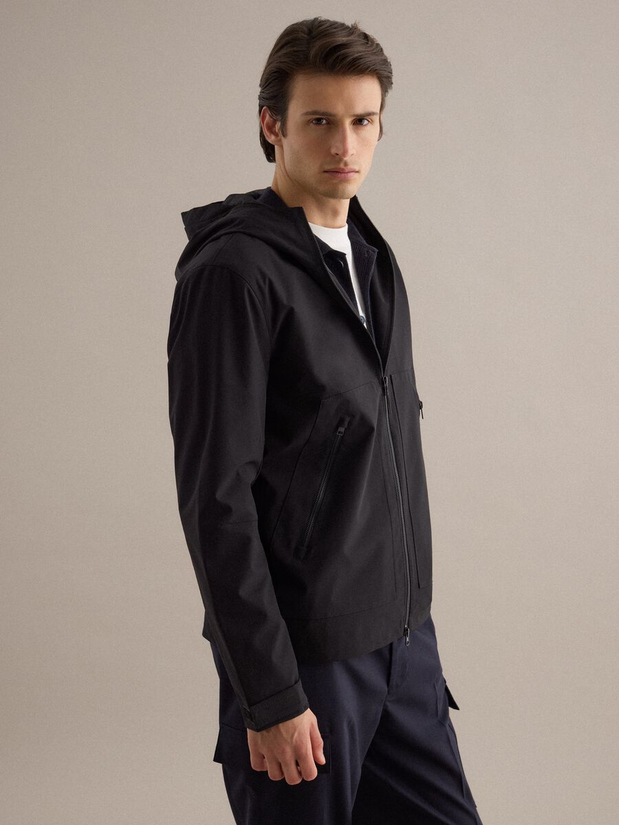 Black regular fit jacket with hood and zip_0