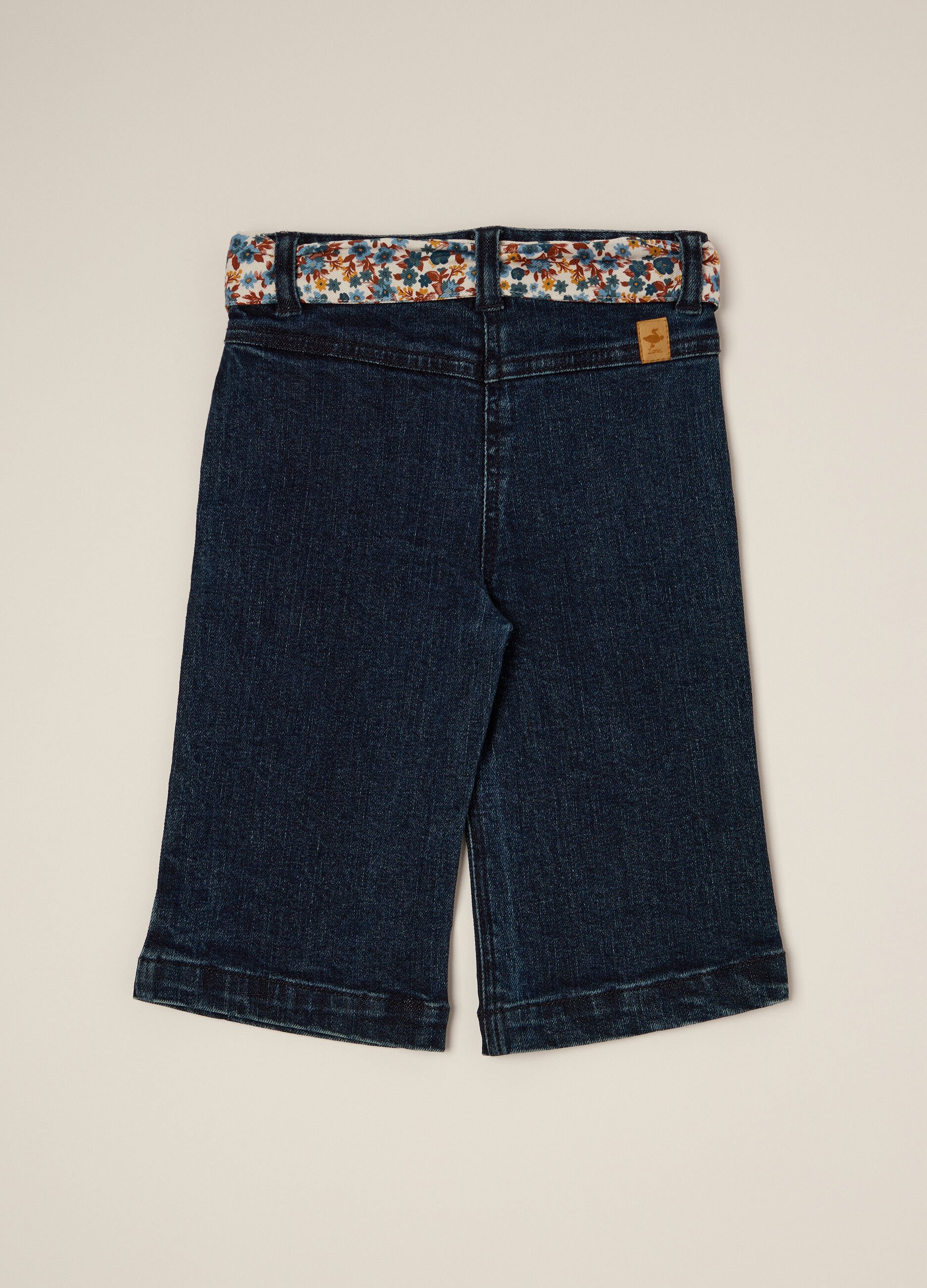 Stretch denim trousers with floral details for girls