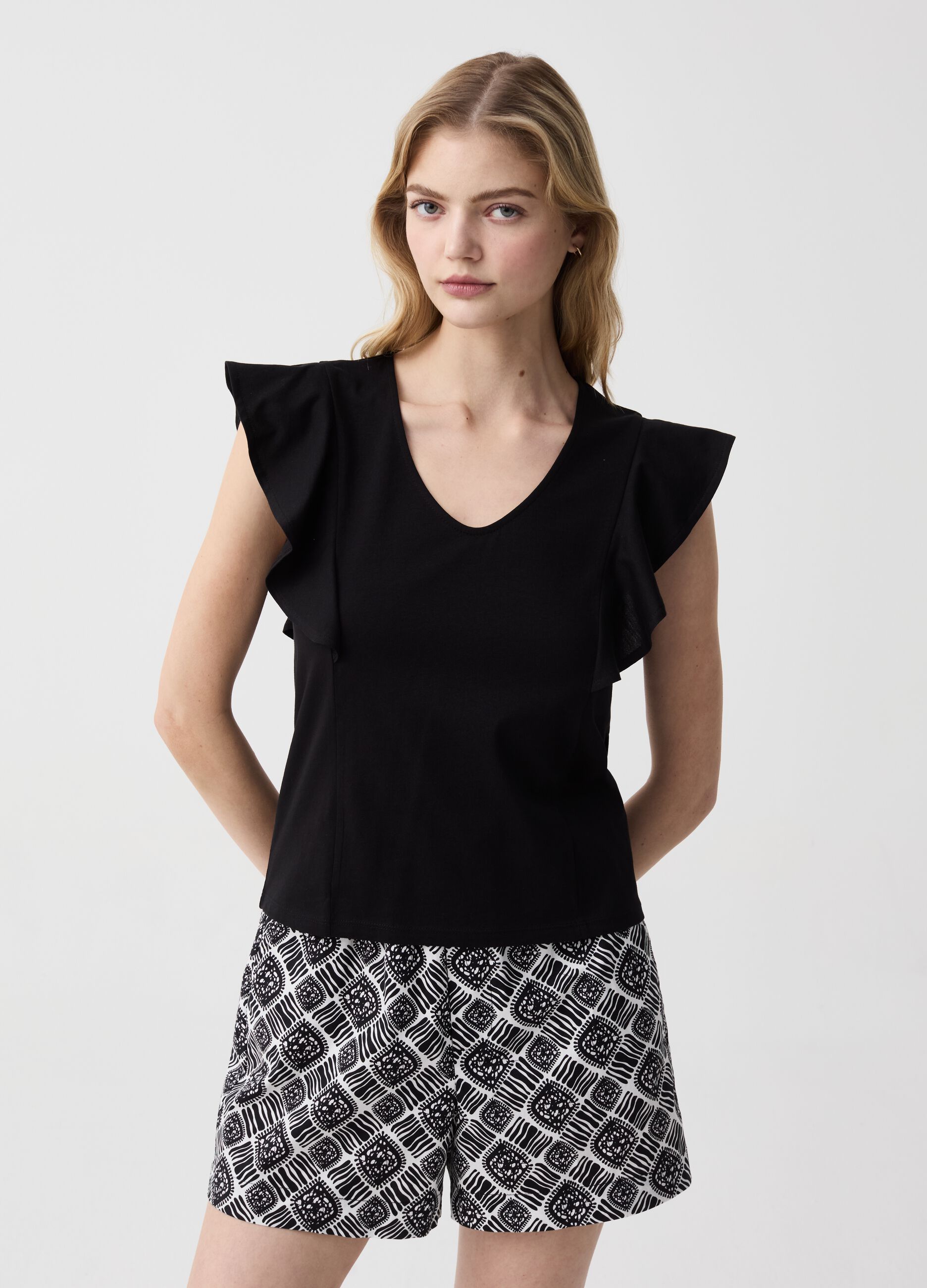 Sleeveless T-shirt with V neck and flounce