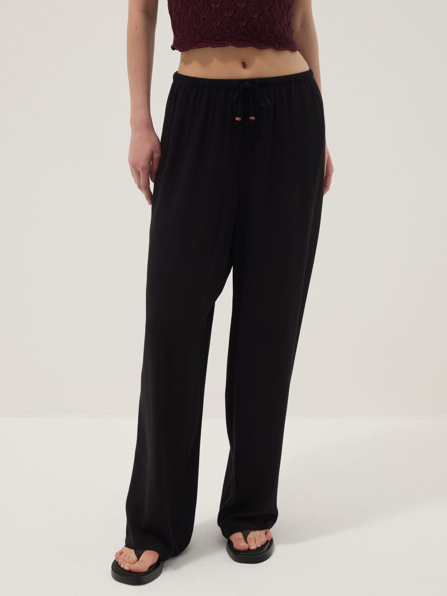 Black palazzo trousers in pure viscose_1