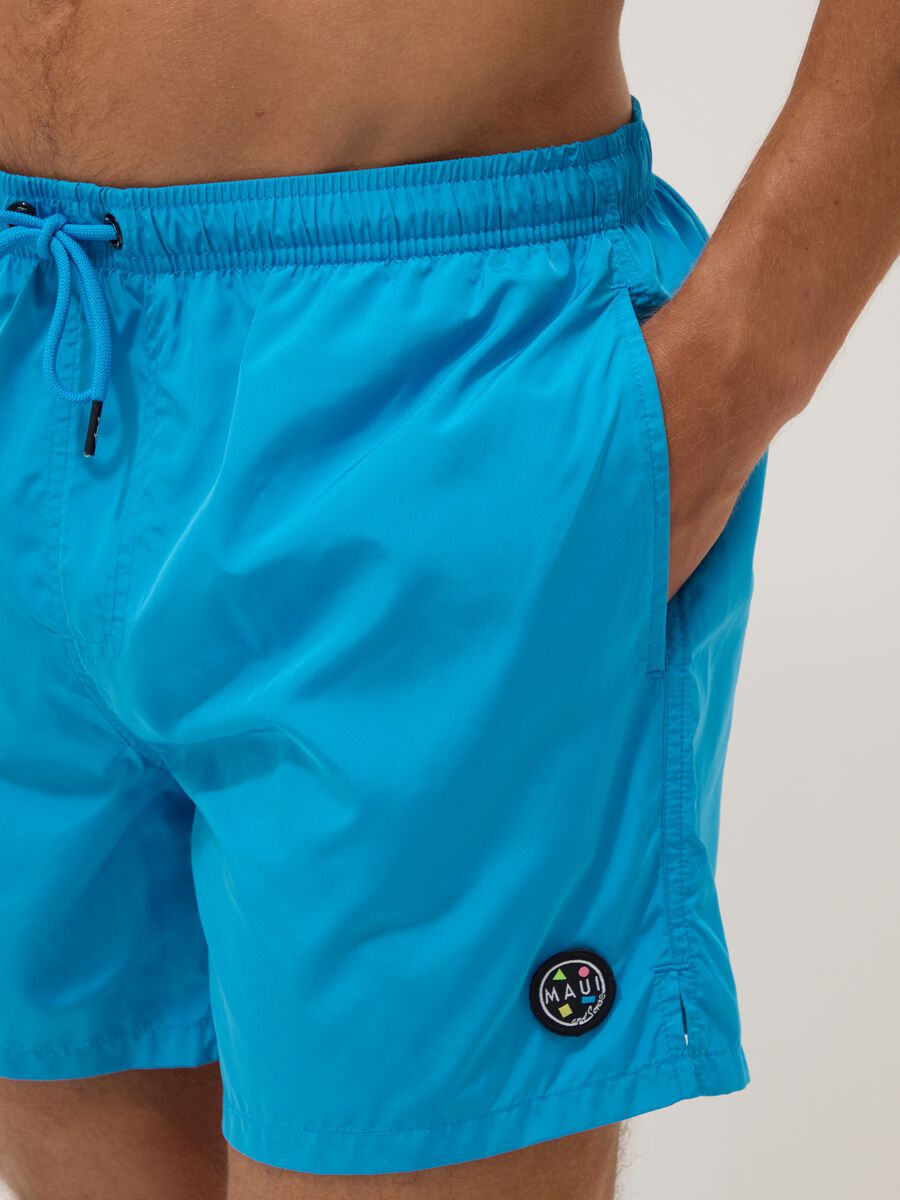 Blue swim shorts with elasticated waist and drawstring_4