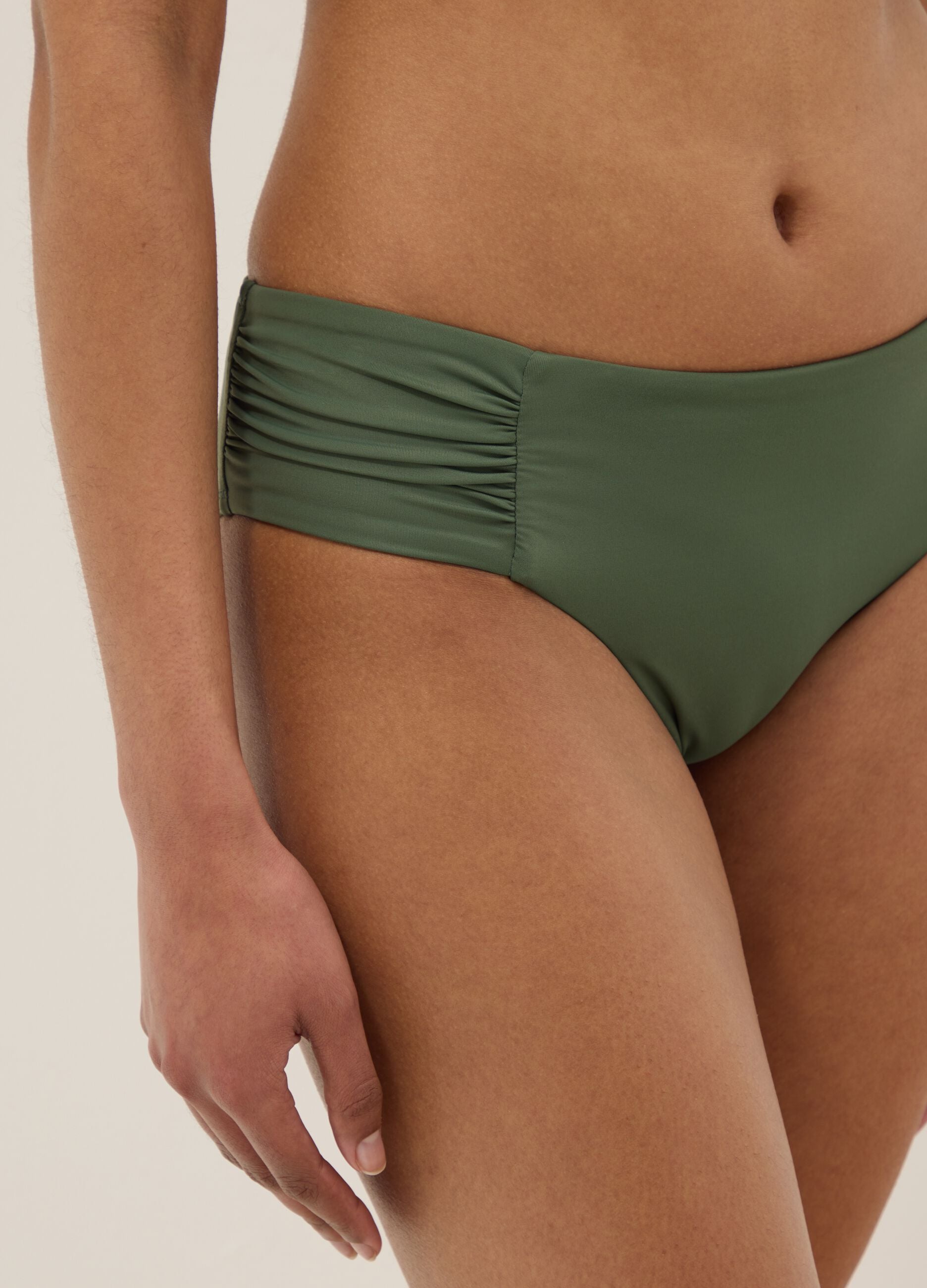 Green stretch swim briefs with side ruching