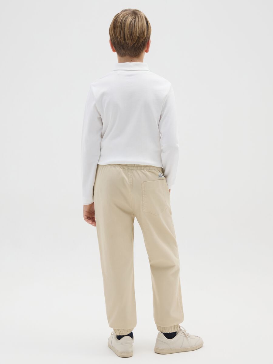 Pantaloni da ragazzo in cotone elasticizzato beige relaxed fit_1