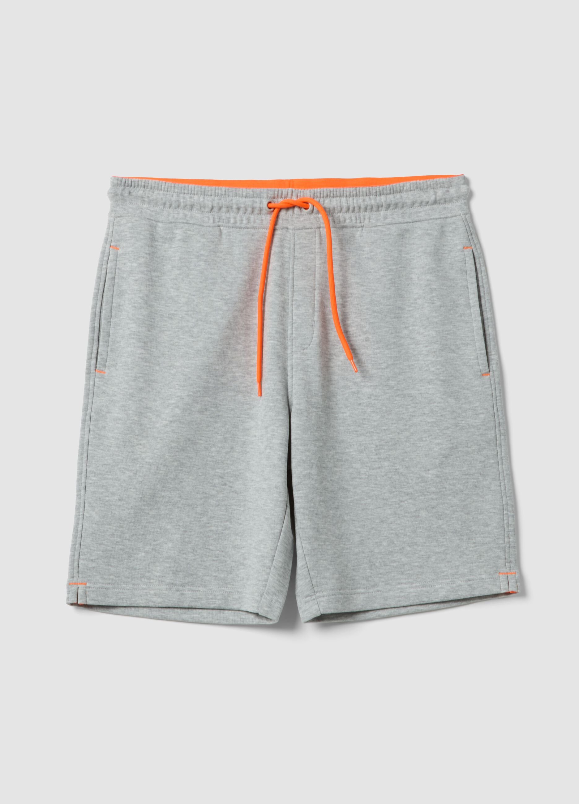 Grey shorts with orange drawstring