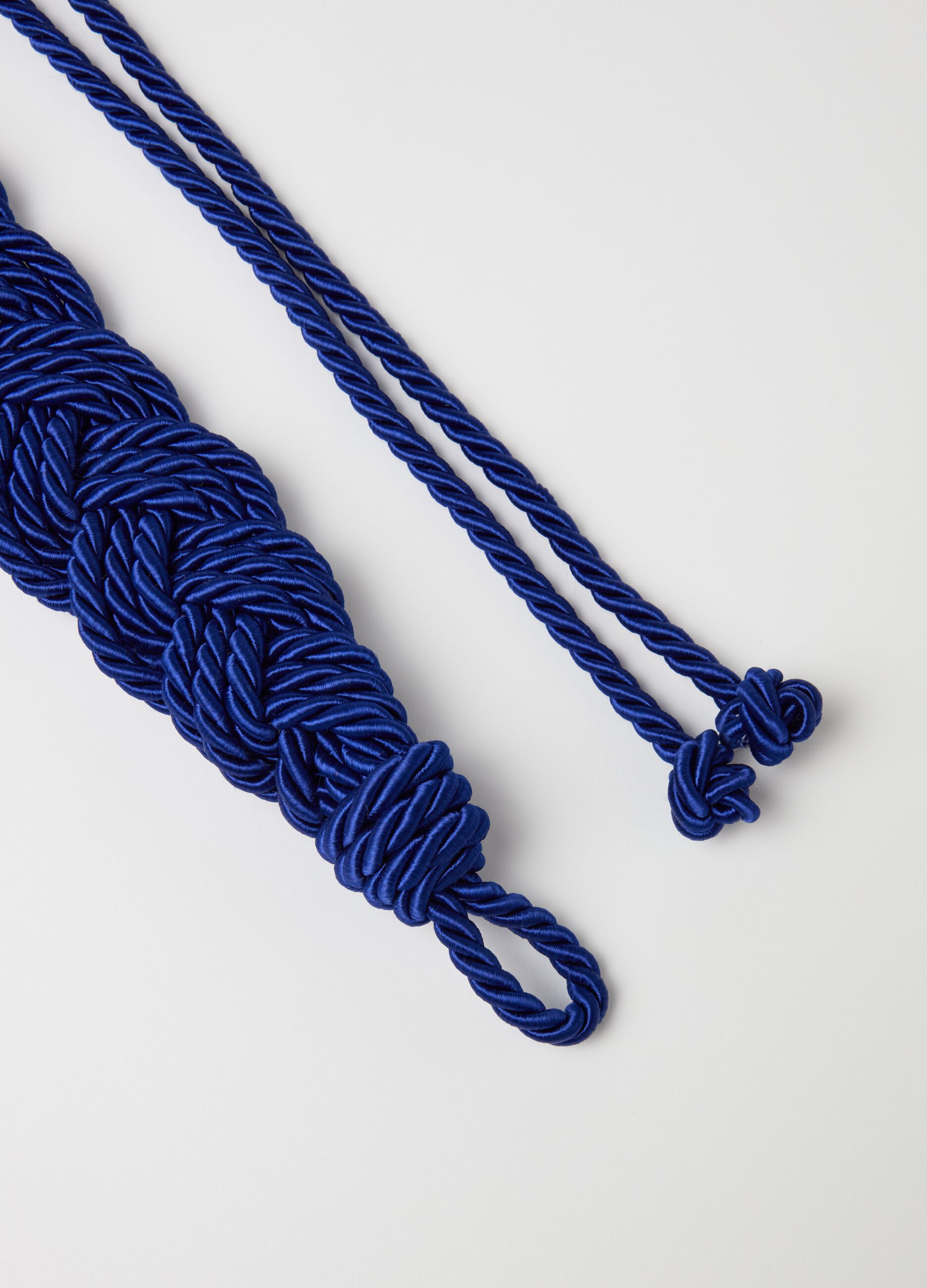 Cord belt with braiding