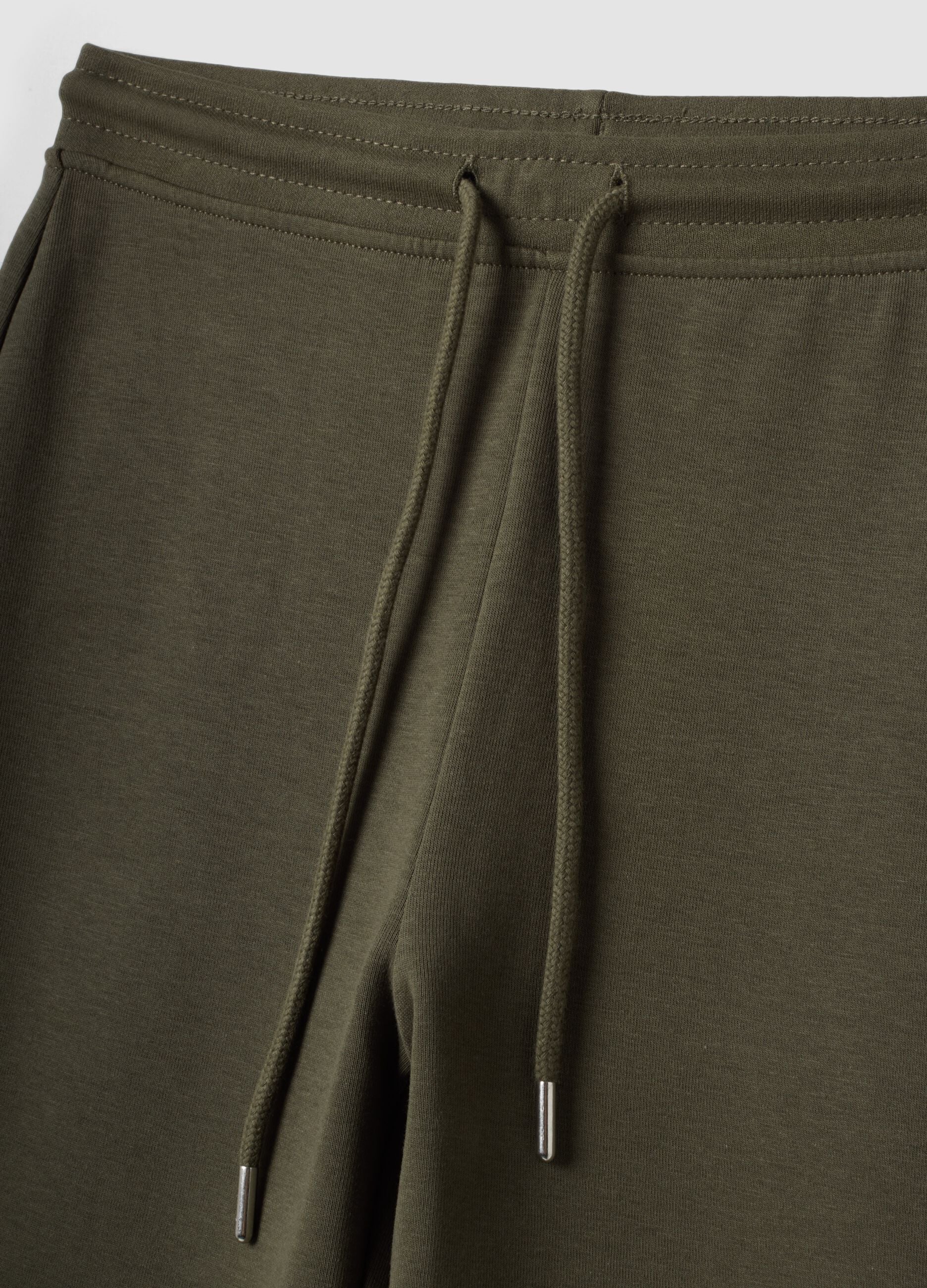Jogger verde flare in cotone organico elasticizzato