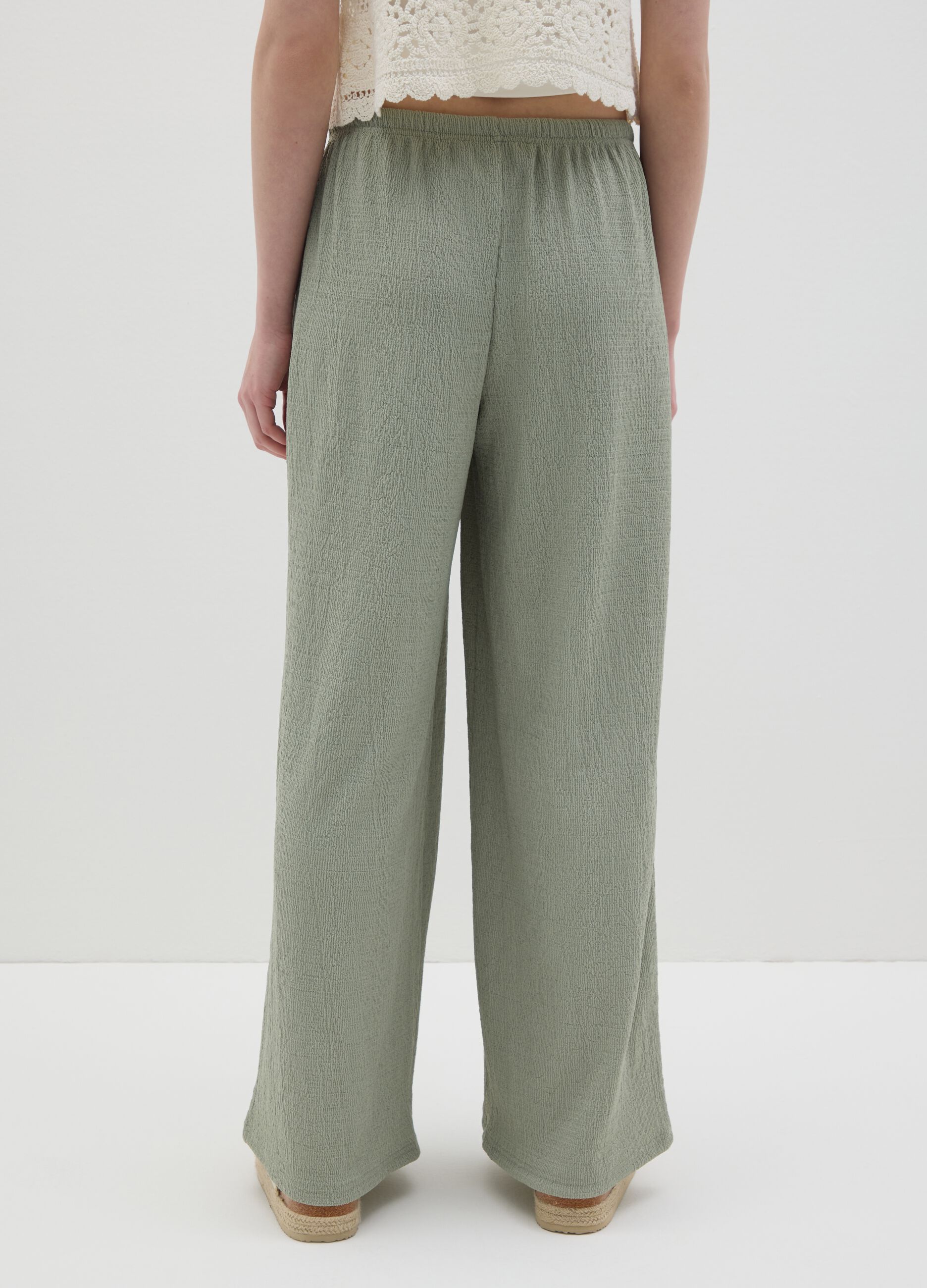 Women’s palazzo pants in green stretch fabric