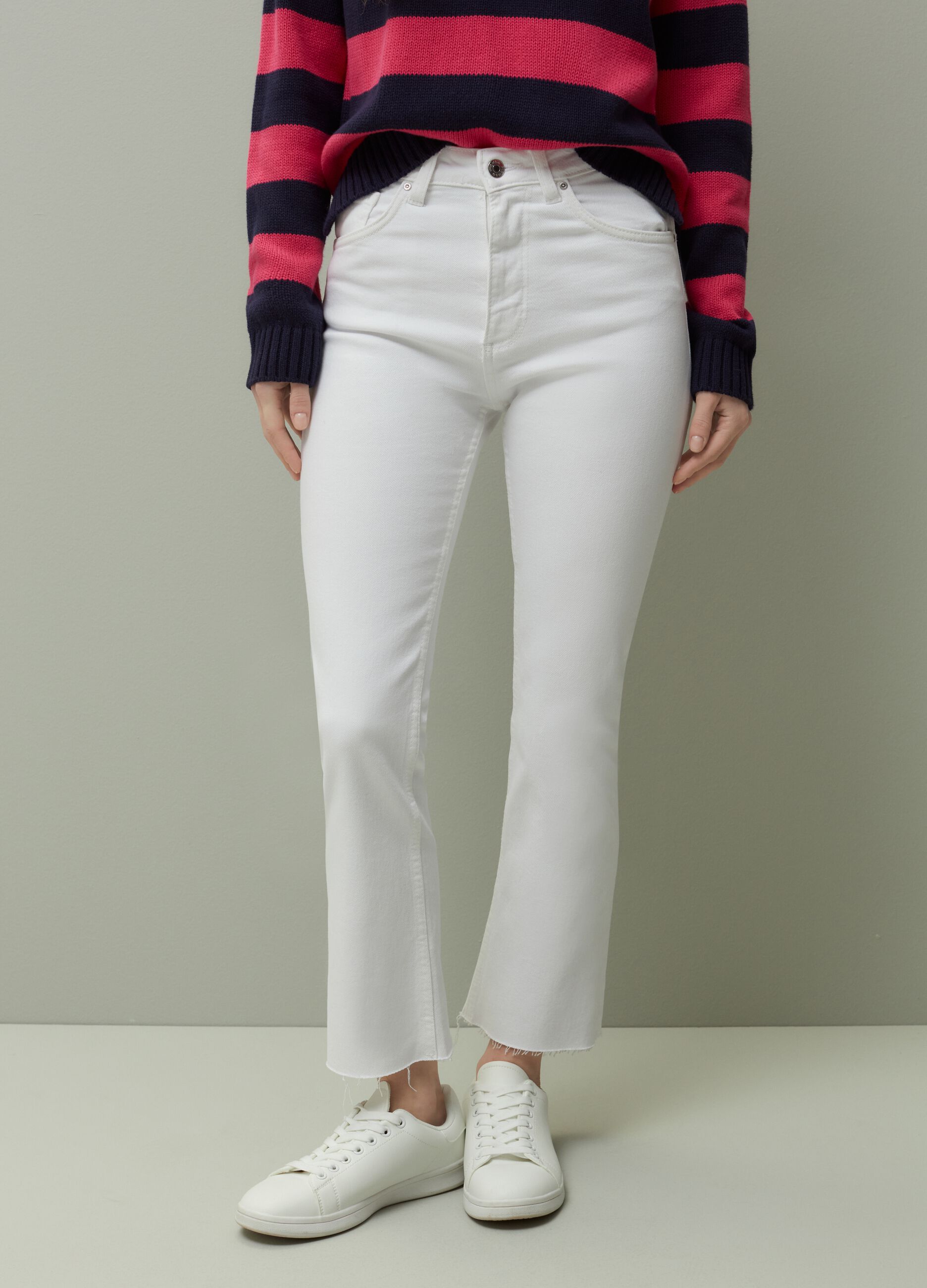 Flared jeans with raw hems