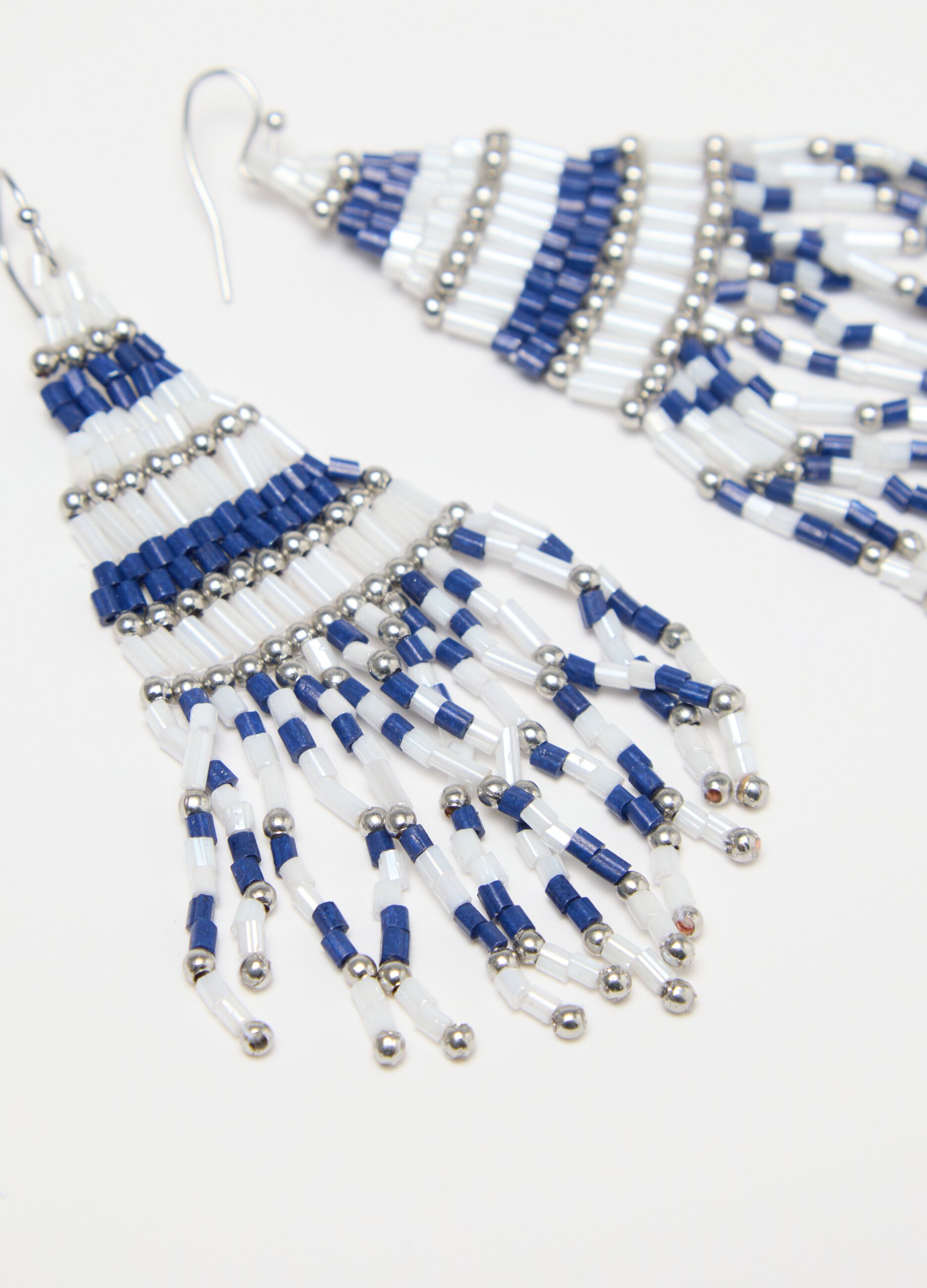 White and blue earrings with fringing