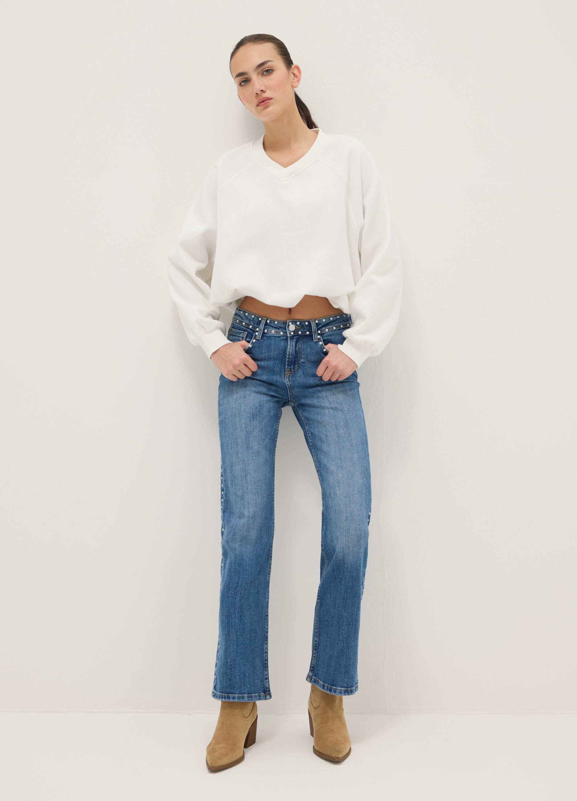 Blue denim bootcut jeans with studs