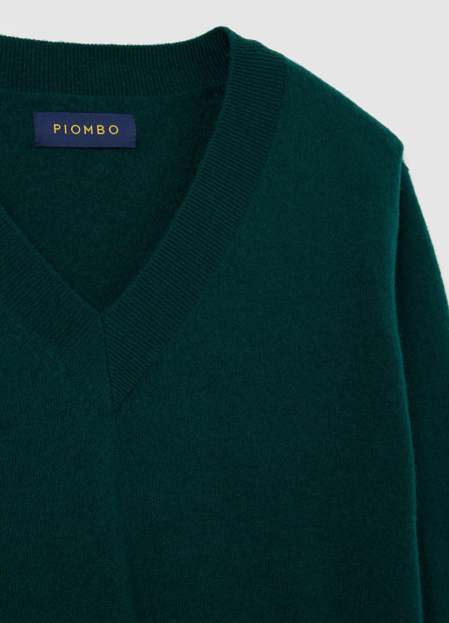 Green V-neck wool sweater