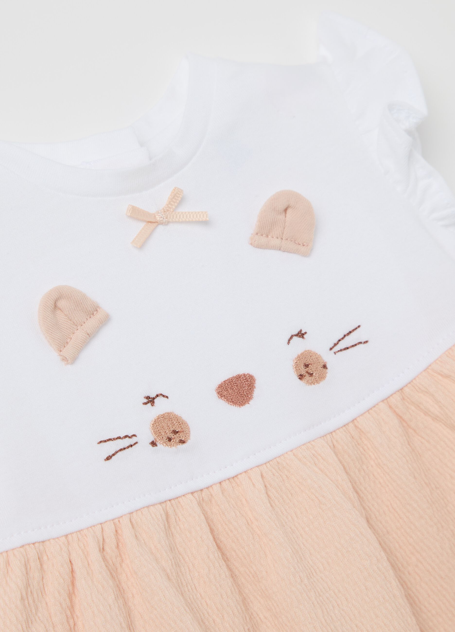 White and orange romper suit with kitten embroidery