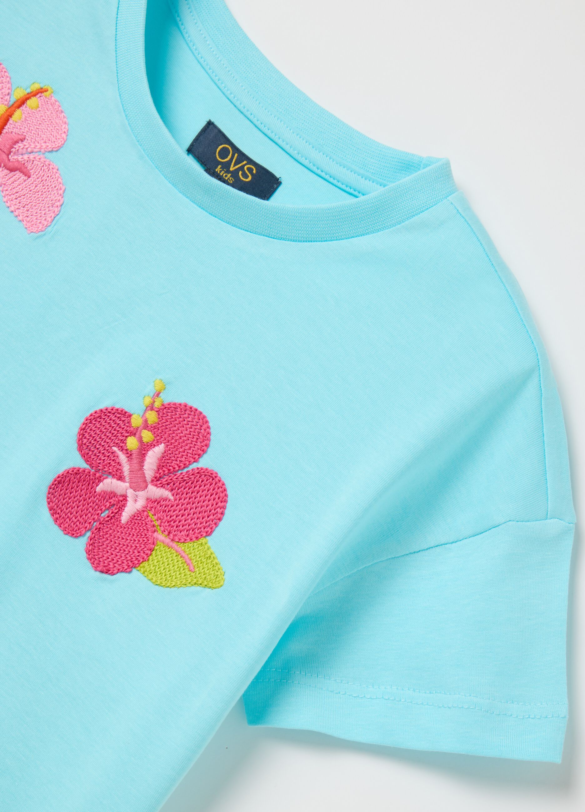Boxy fit light blue T-shirt with embroidered flowers