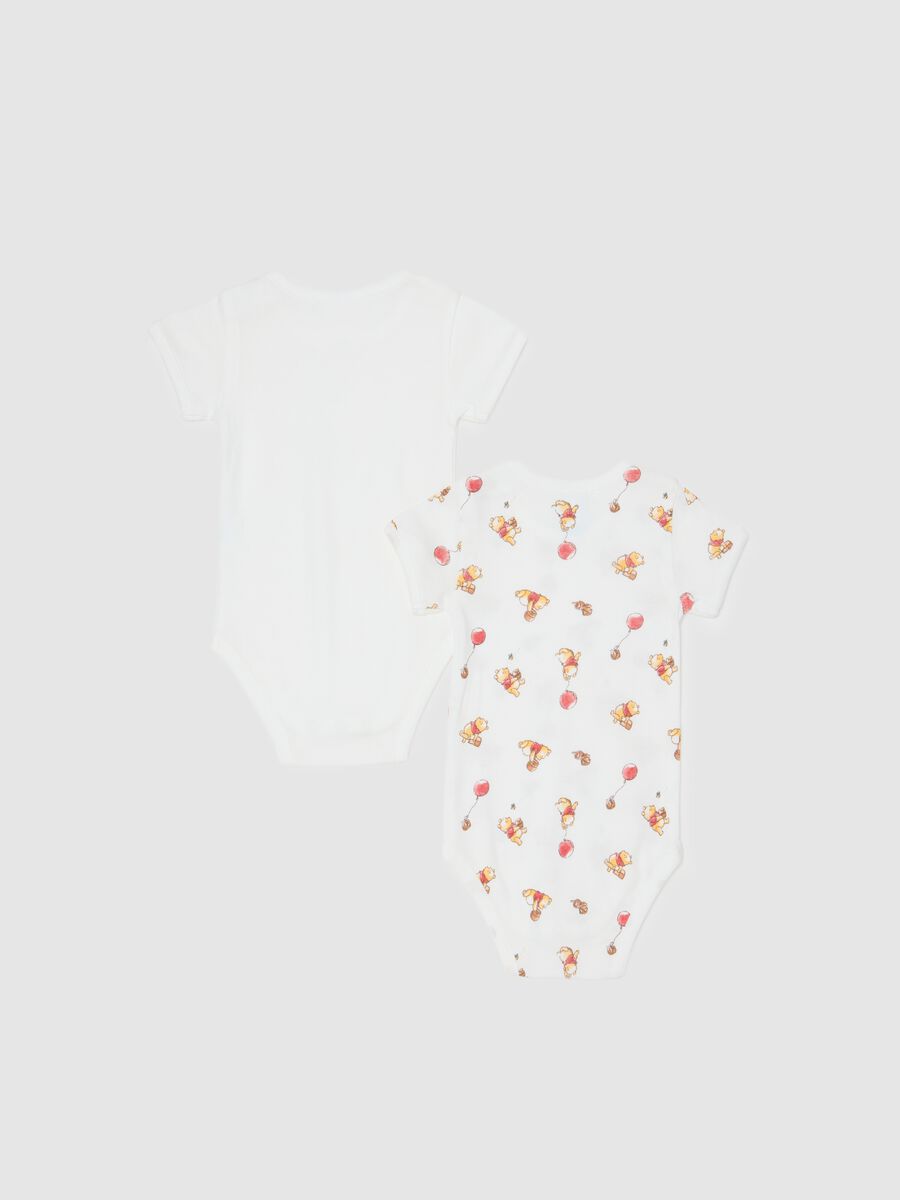 Set of two white newborn bodysuits in pure cotton_1