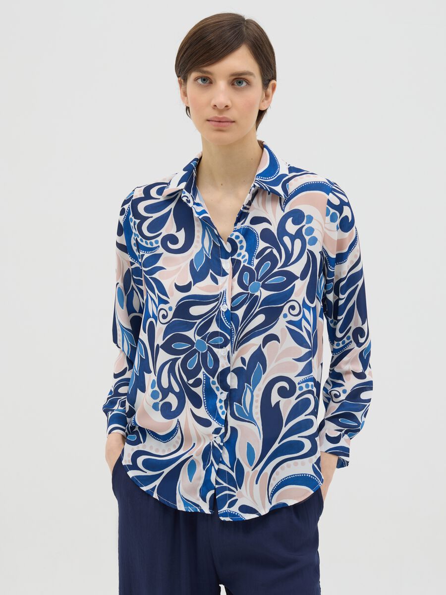 Blue and beige shirt with floral pattern_0