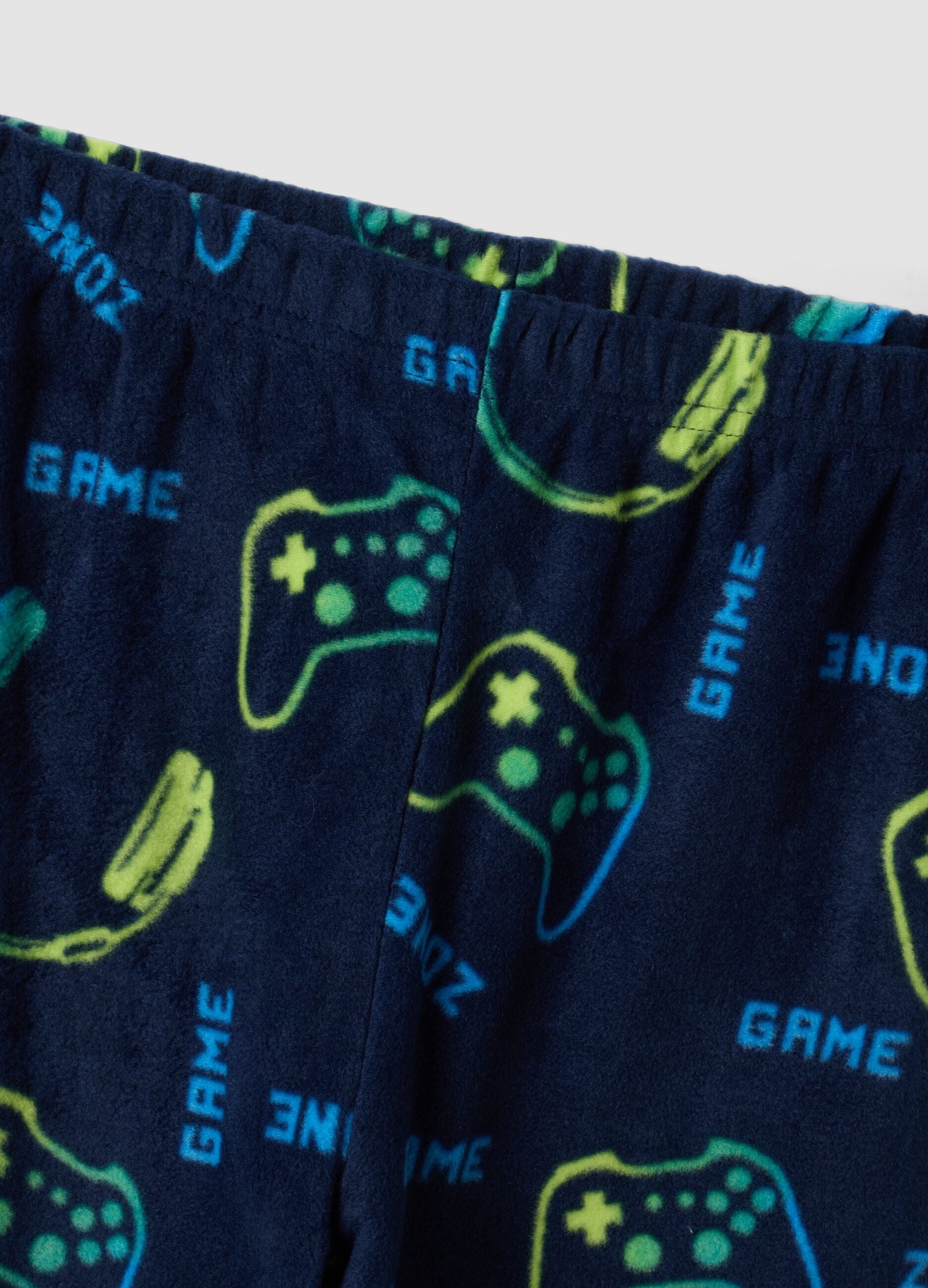 Blue crew-neck pyjamas with video game print trousers