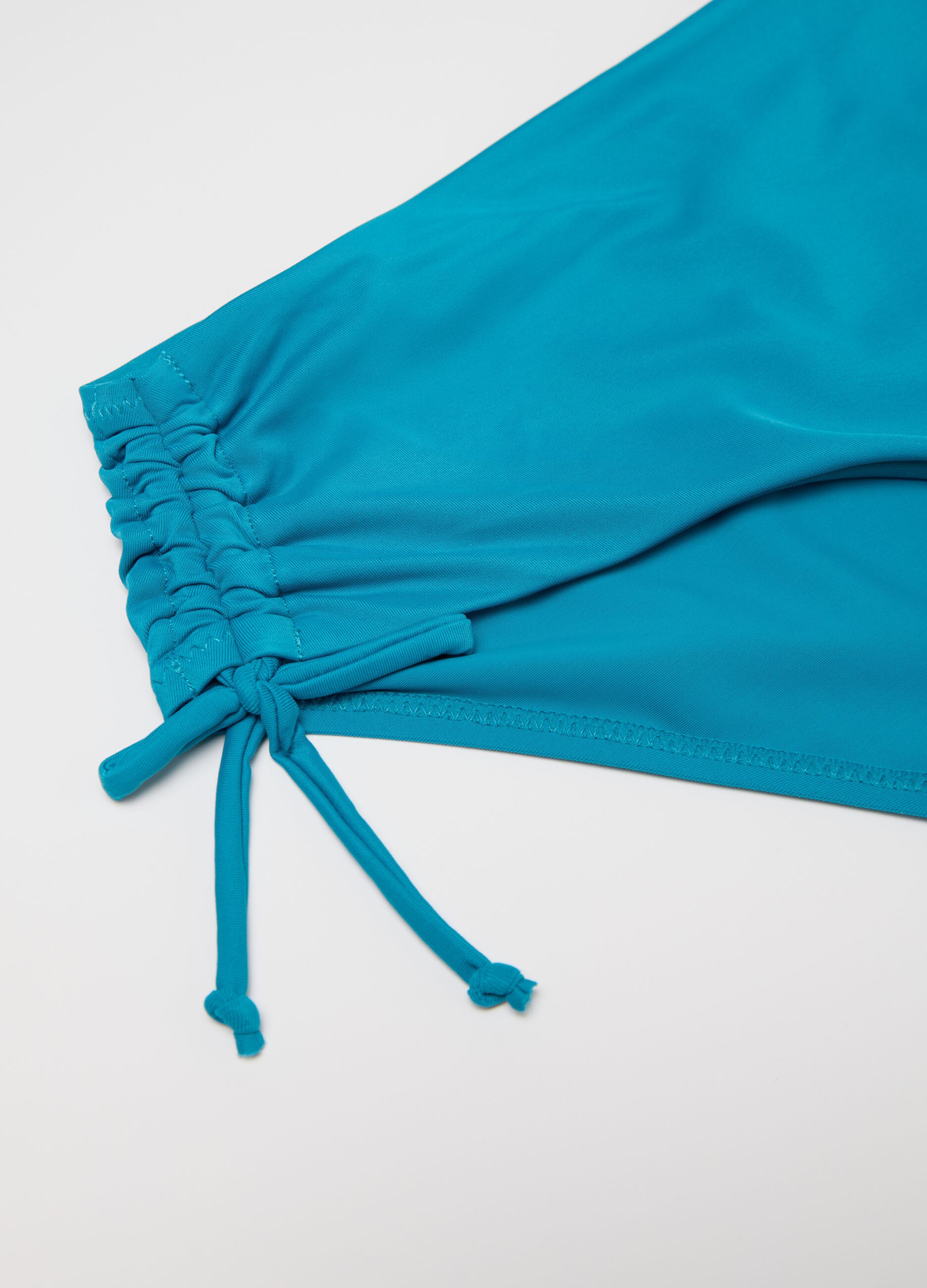 Slip bikini da donna in lycra elasticizzata azzurra con arricciature 
