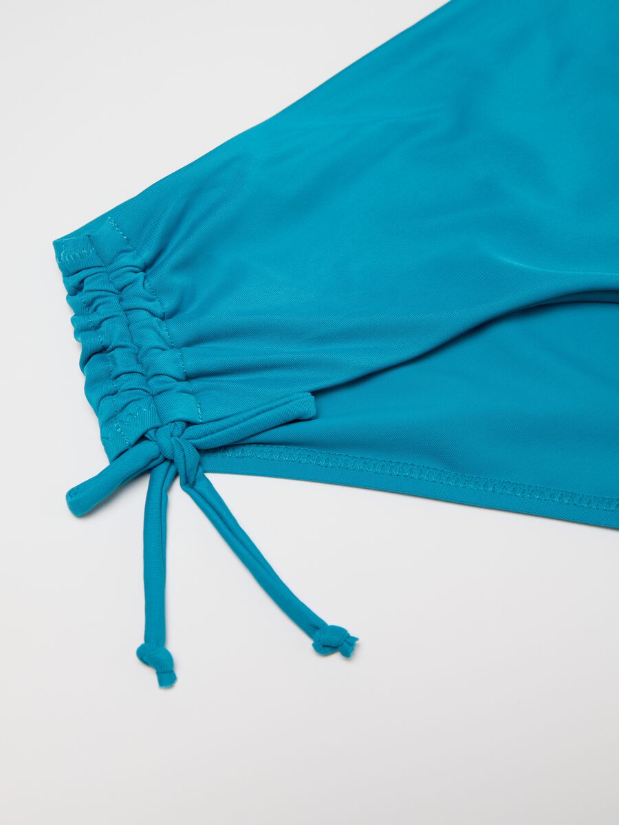 Women’s bikini briefs in light blue stretch blend with gathered sides._5