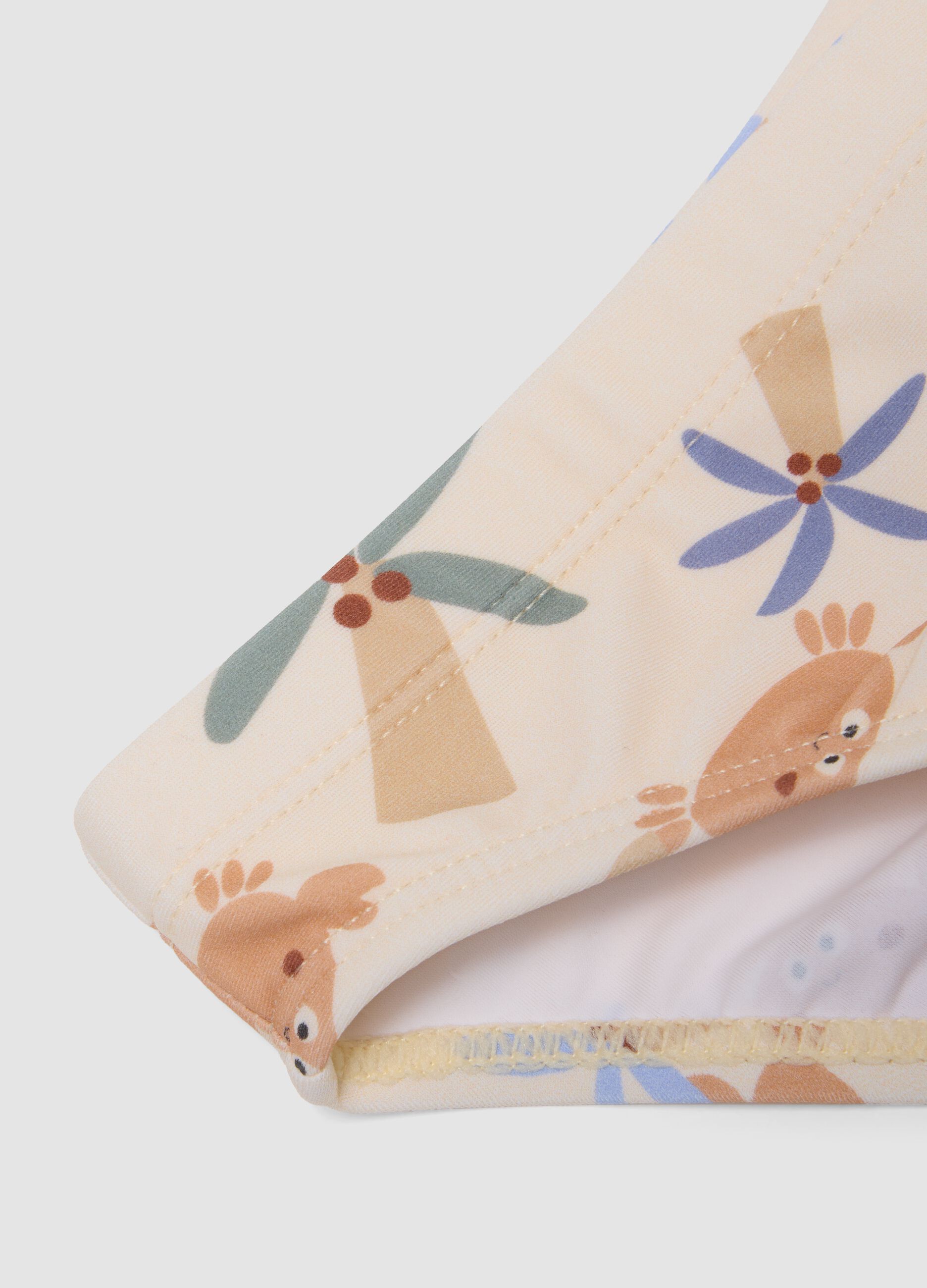 Beige baby swim briefs with prints
