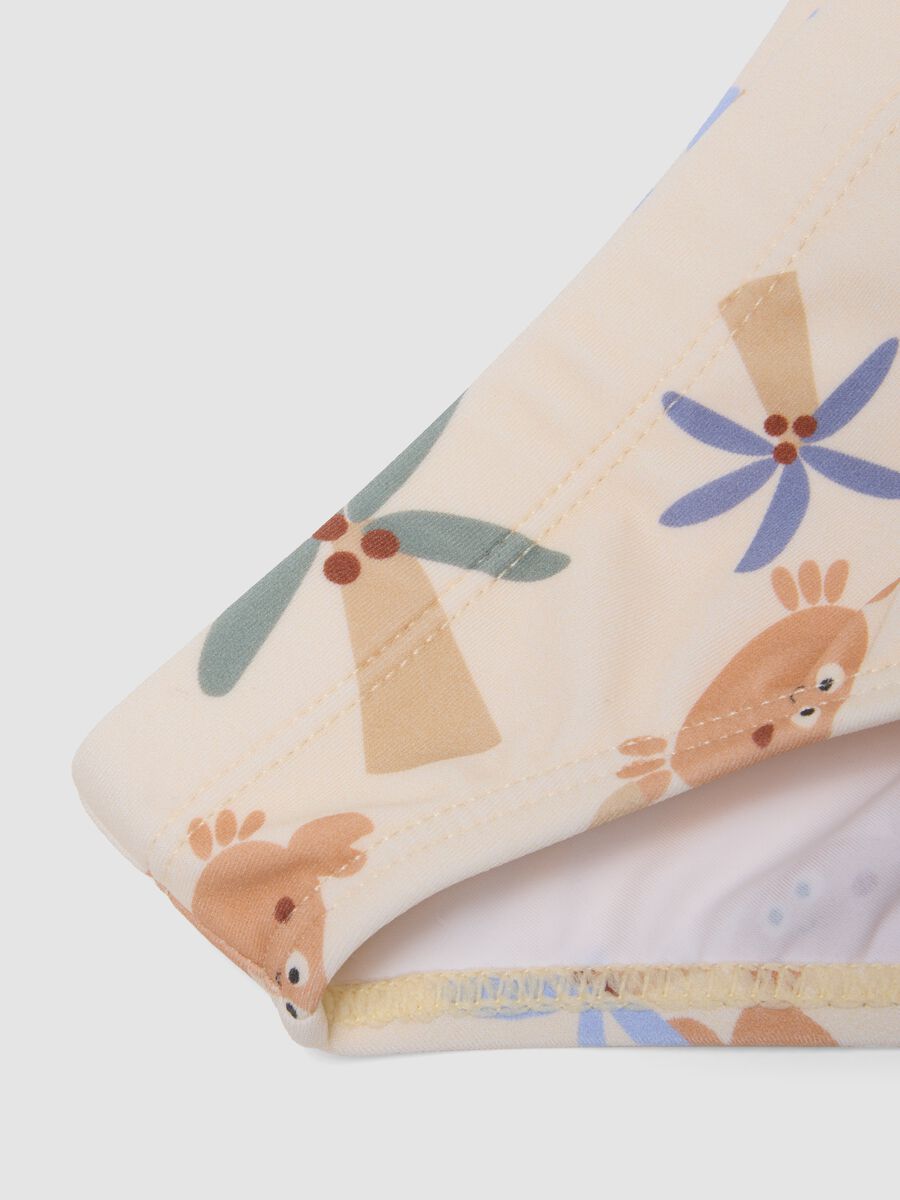Beige baby swim briefs with prints_3