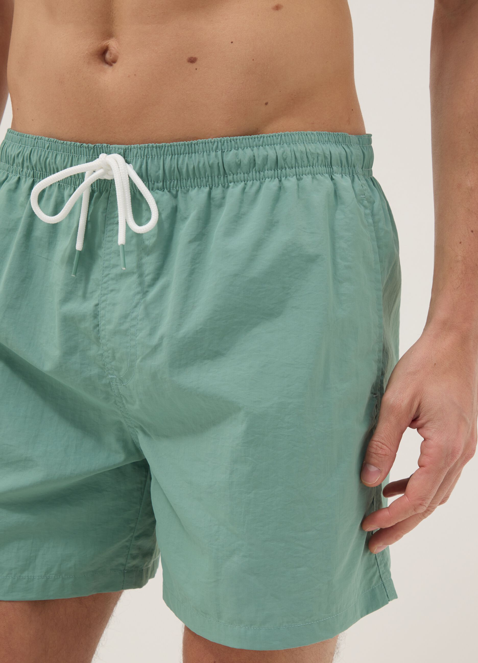 Green swim shorts with elasticated waistband