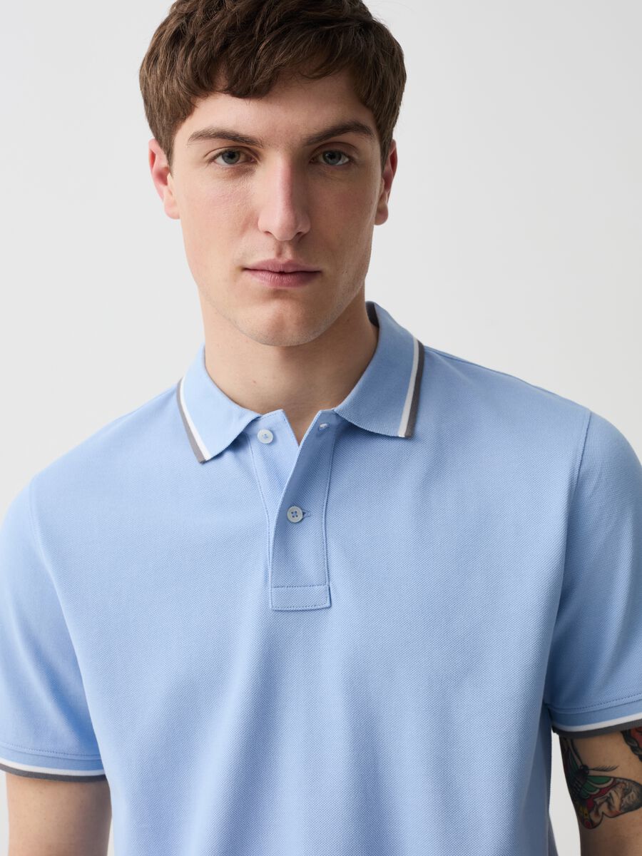 Polo shirt in piquet with striped edging_1