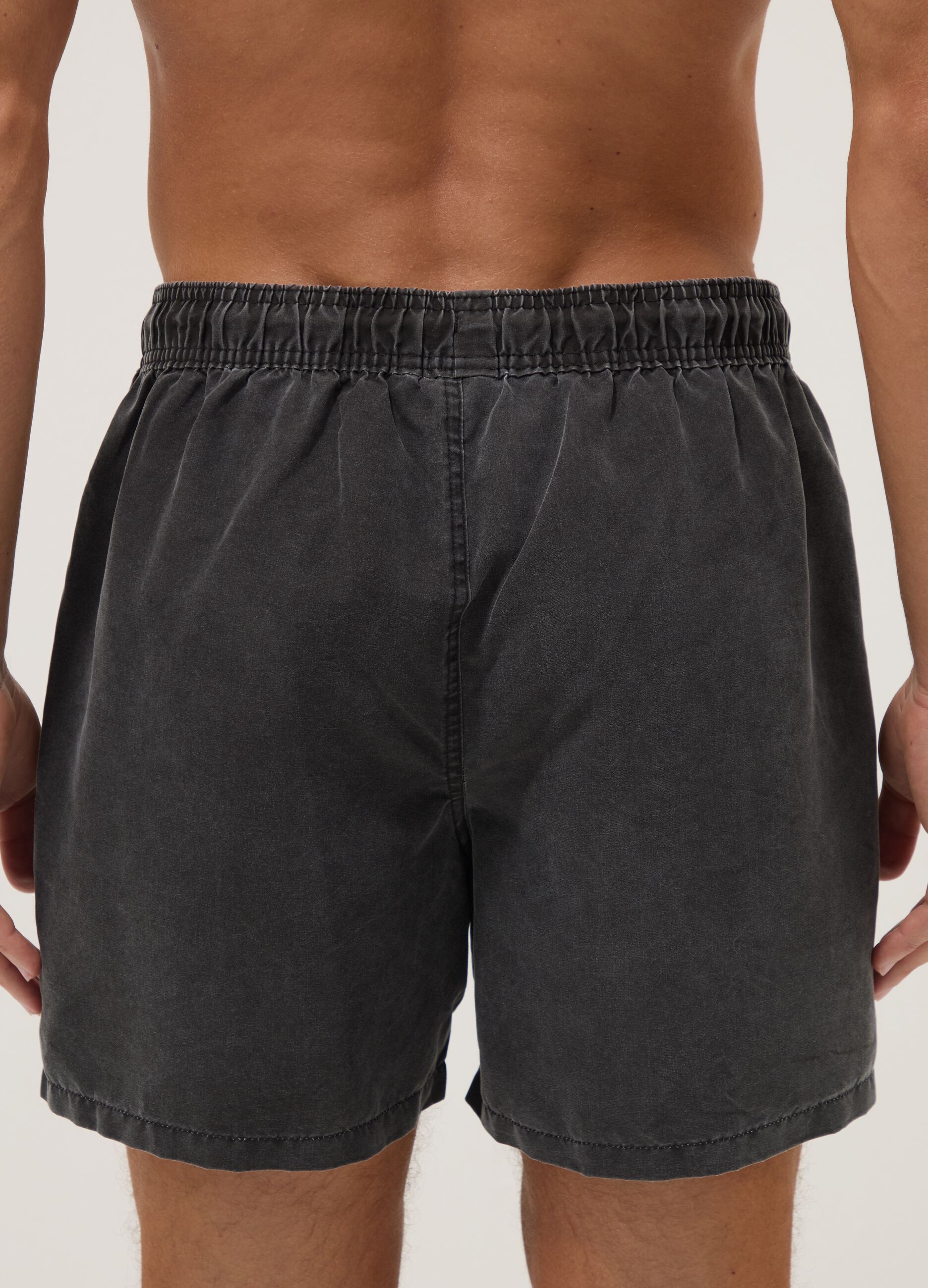 Black swim shorts with drawstring waist