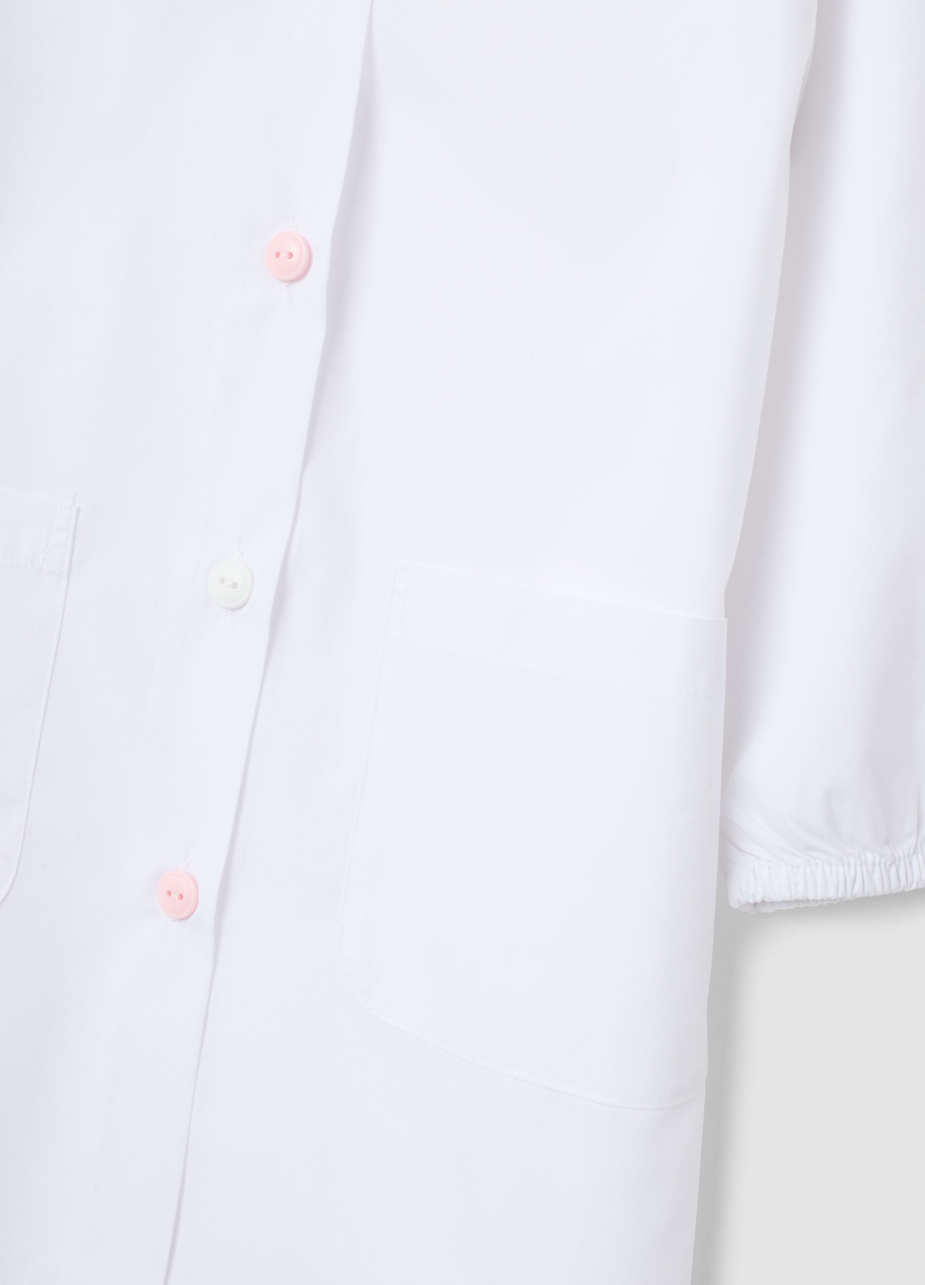 2-pack of white nursery school aprons with classic collar