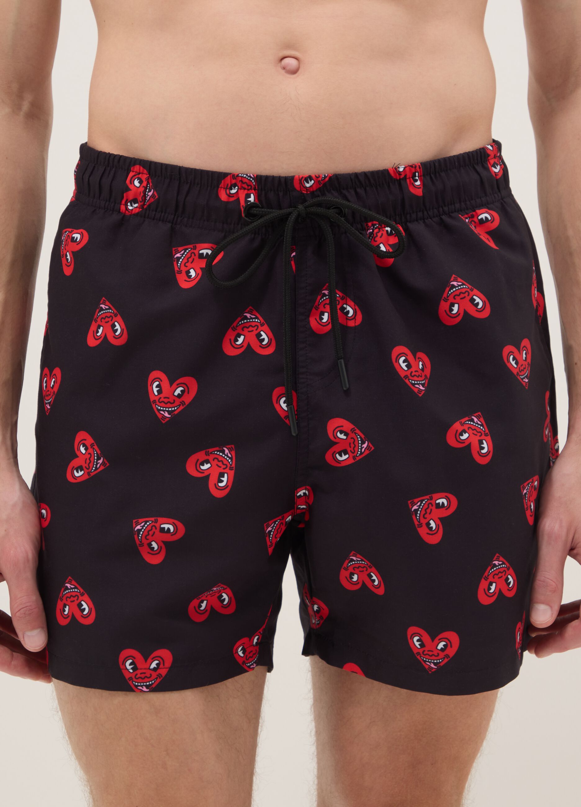 Black beach boxers with Keith Haring heart prints
