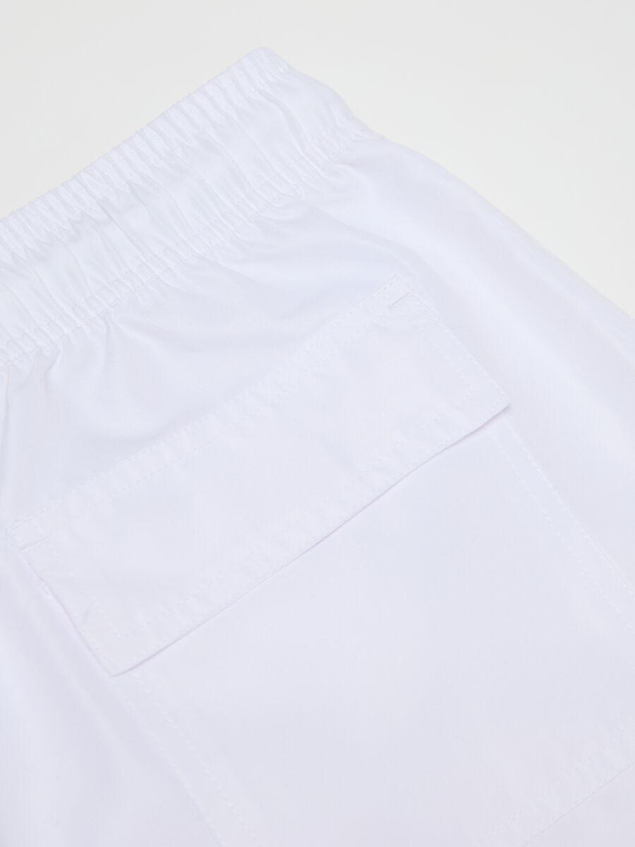 White swimming trunks with logo print_1