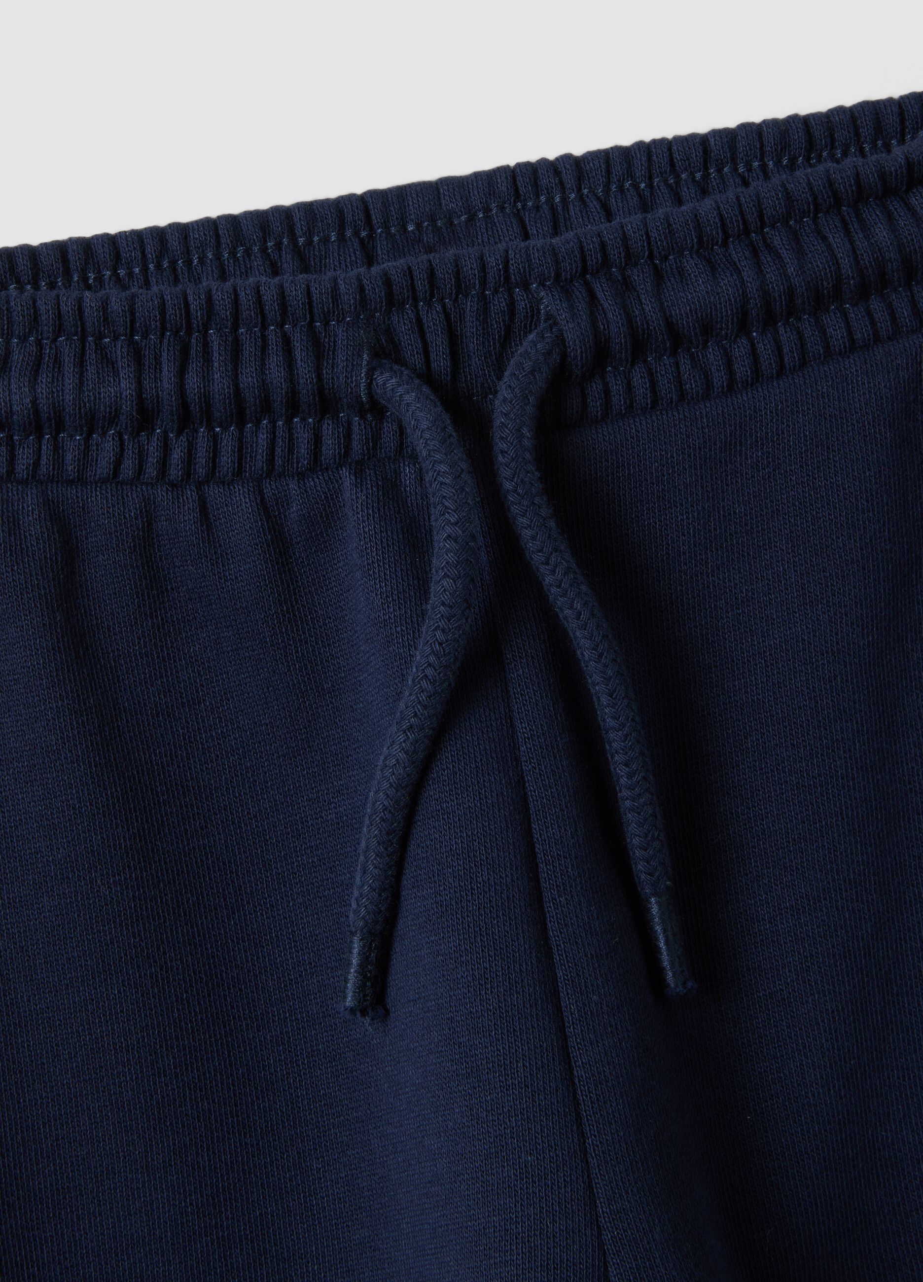 Pantaloni jogger blu in puro cotone organico con coulisse per bimbo