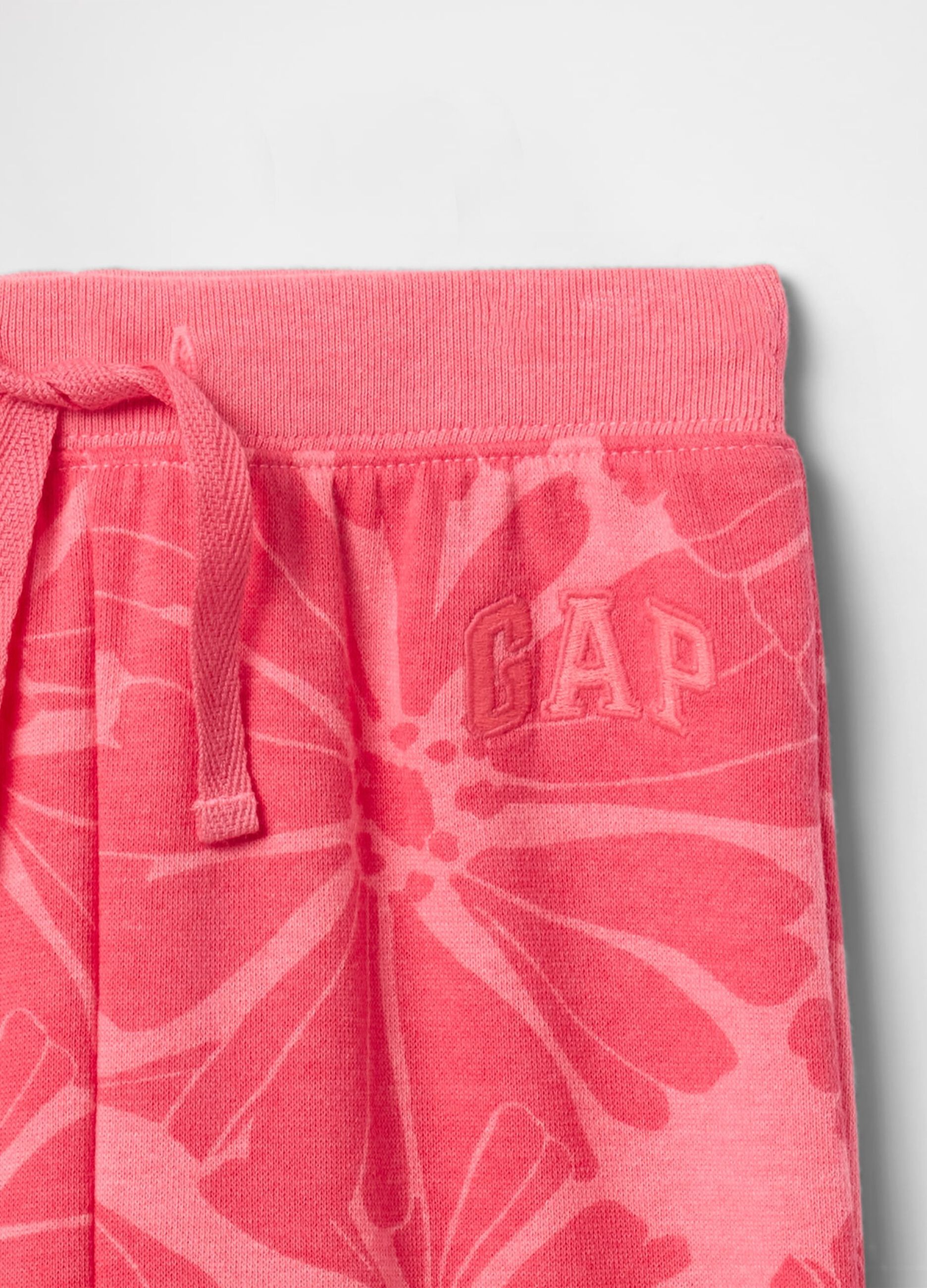 Pink wide-leg joggers with logo embroidery and flowers print