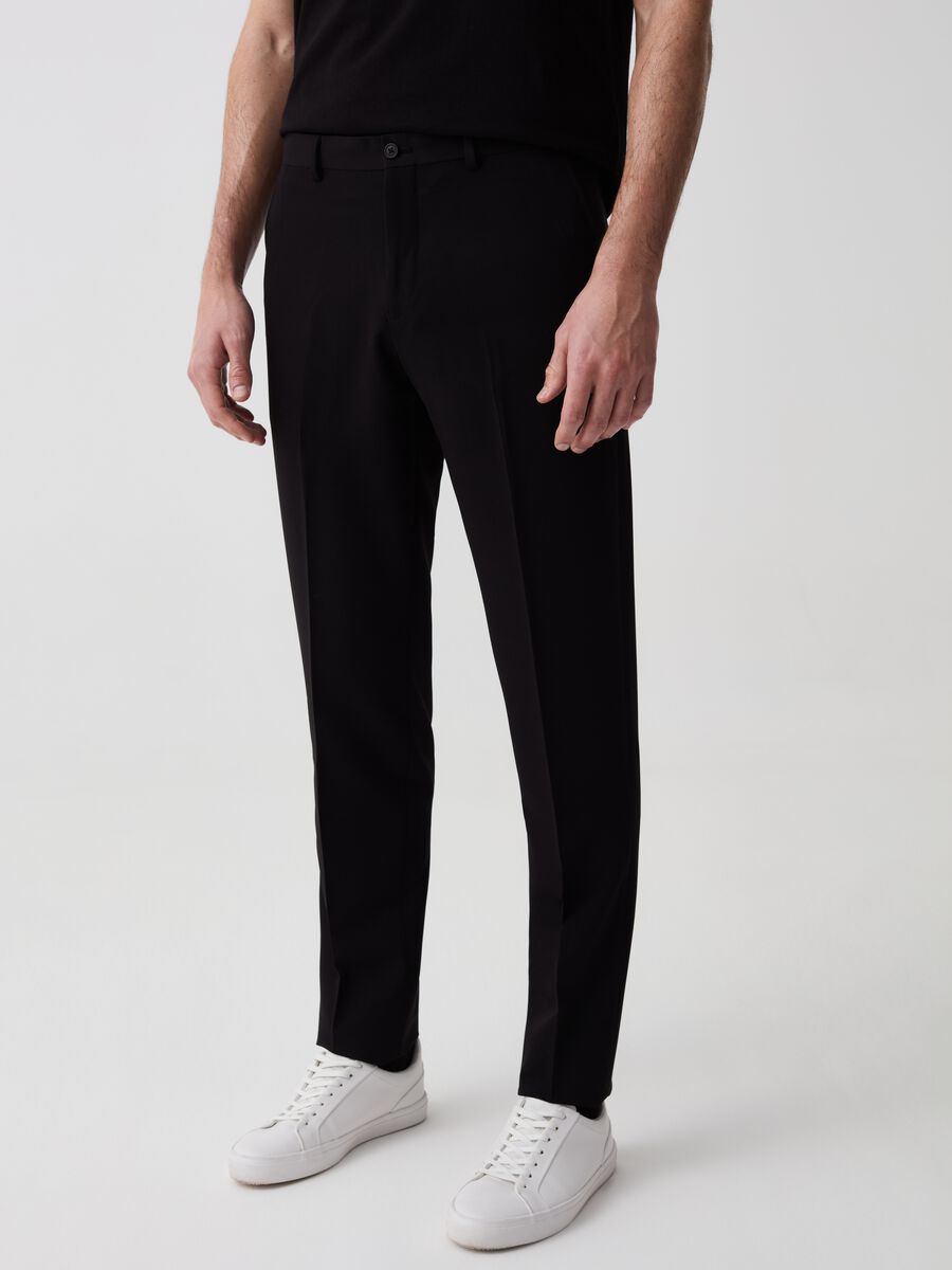 Solid colour slim-fit trousers_1