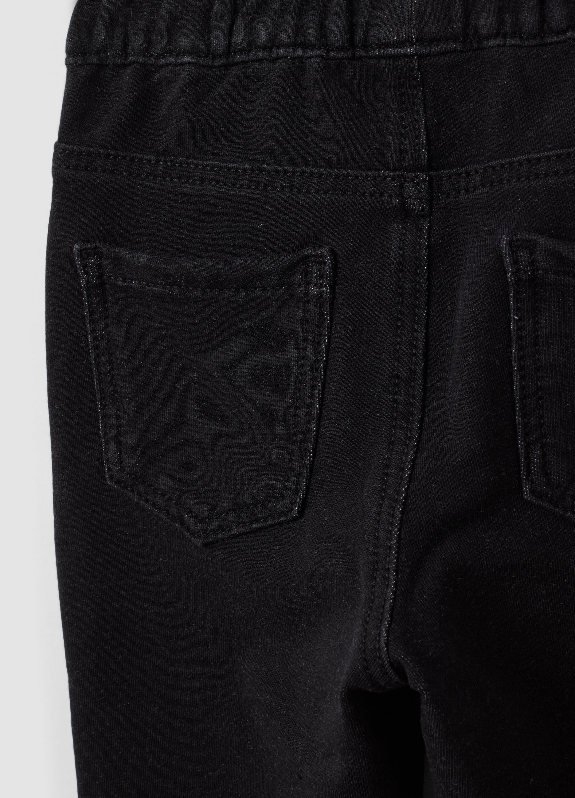 Jeggings nero flare in cotone elasticizzato per bambina