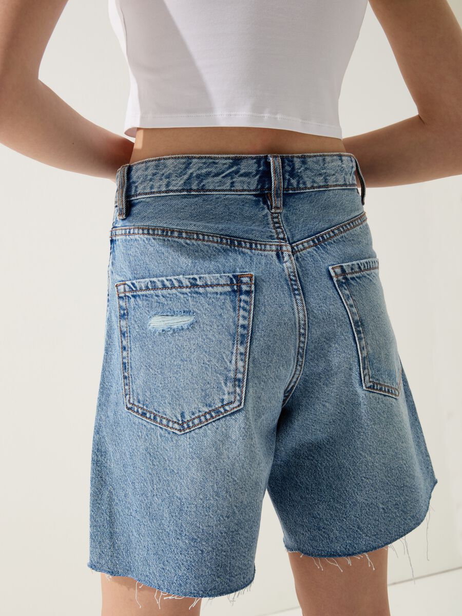 Denim Bermuda shorts with abrasions_1