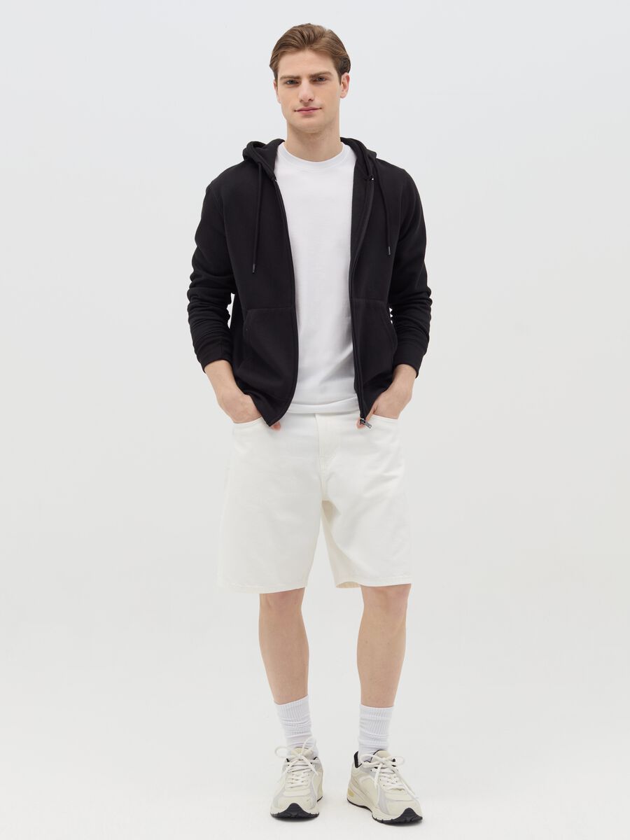 Baggy-fit Bermuda shorts in denim with five pockets_0