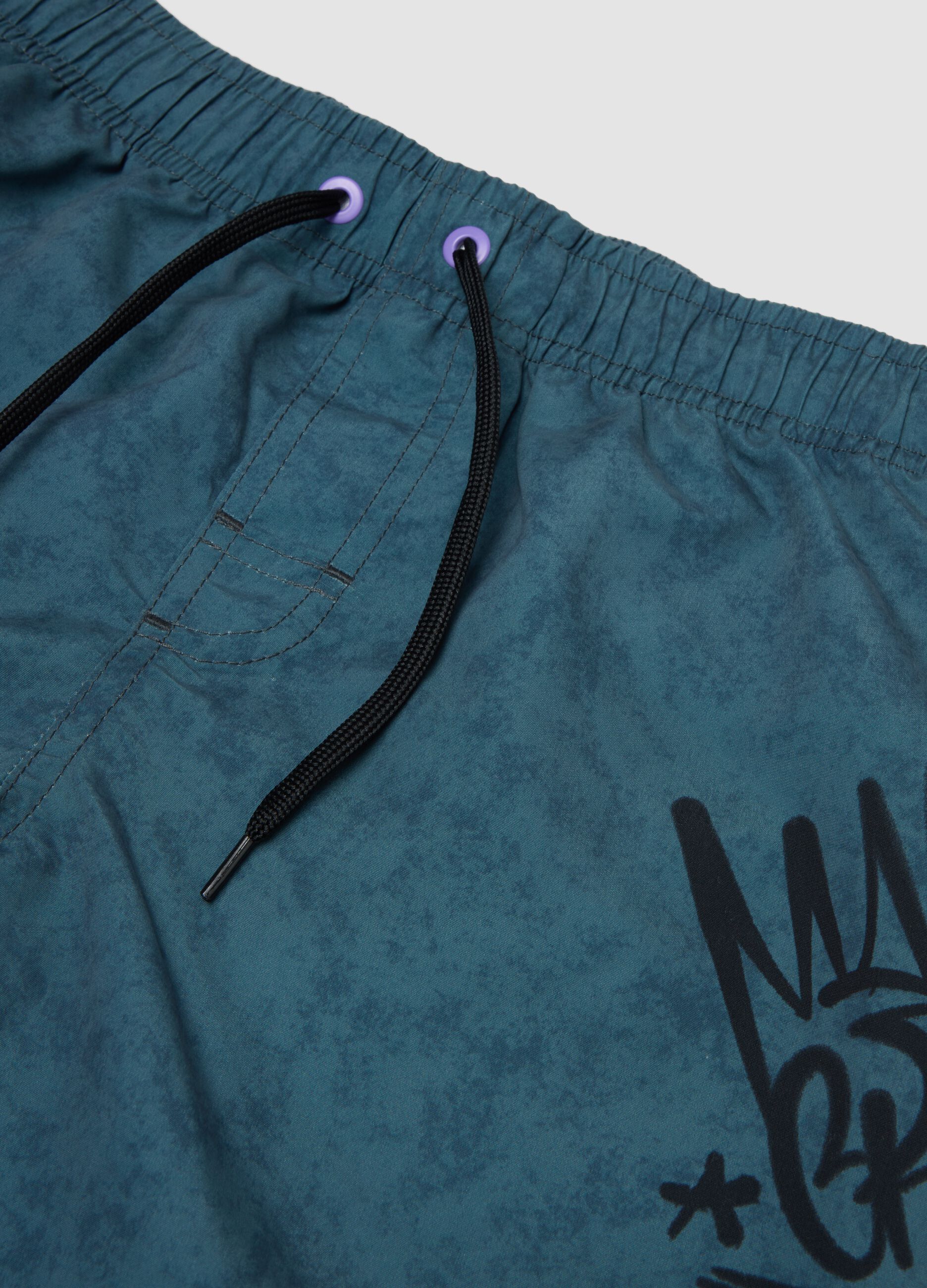 Blue swim shorts with print