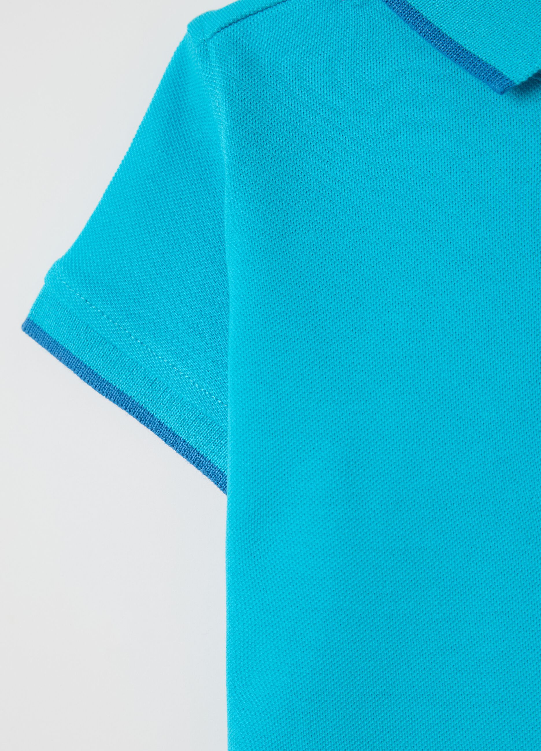 Light blue polo shirt in piquet with hippopotamus surfer