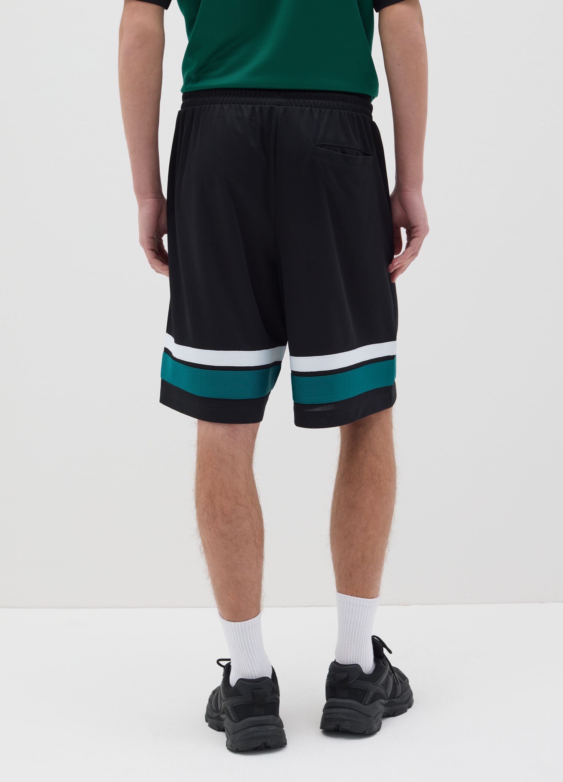 Black Bermuda joggers with NFC print