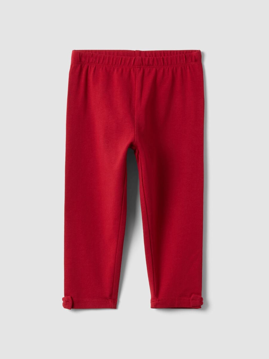 Leggings rossi in cotone organico elasticizzato con fiocchi per bimba_0