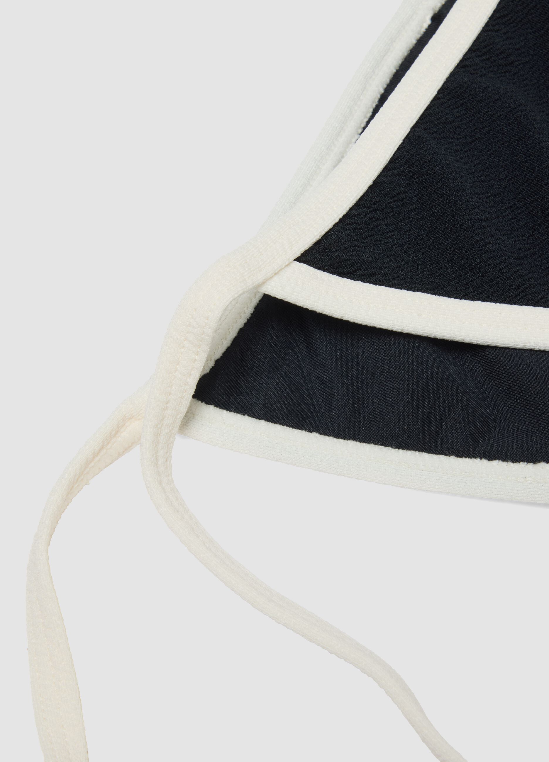 Black and white bikini bottoms in stretch fabric with side ties