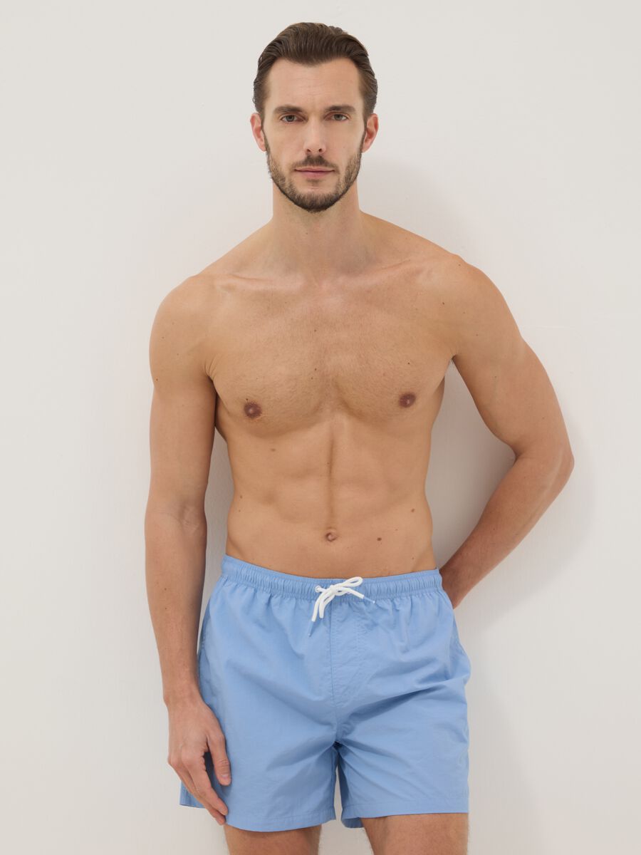Blue swim shorts with elasticated waist_0