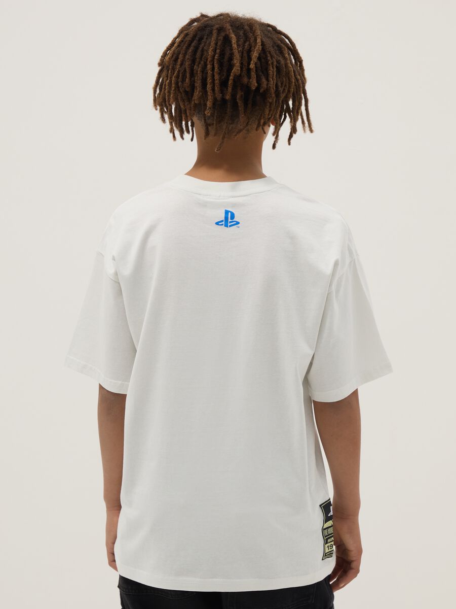 T-shirt in puro cotone bianca oversize fit con stampa da ragazzo_1
