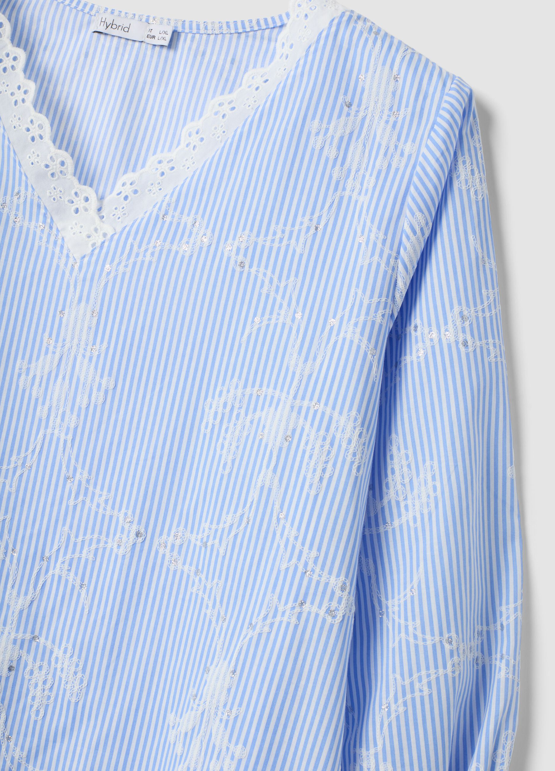 Blue cotton-blend top with embroidery and V-neck