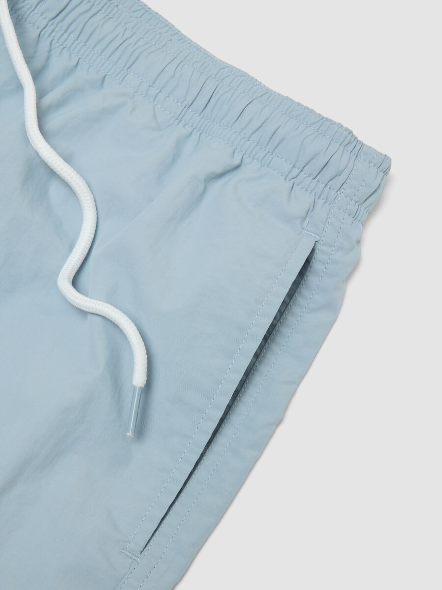 Blue swim shorts with elasticated waistband_5
