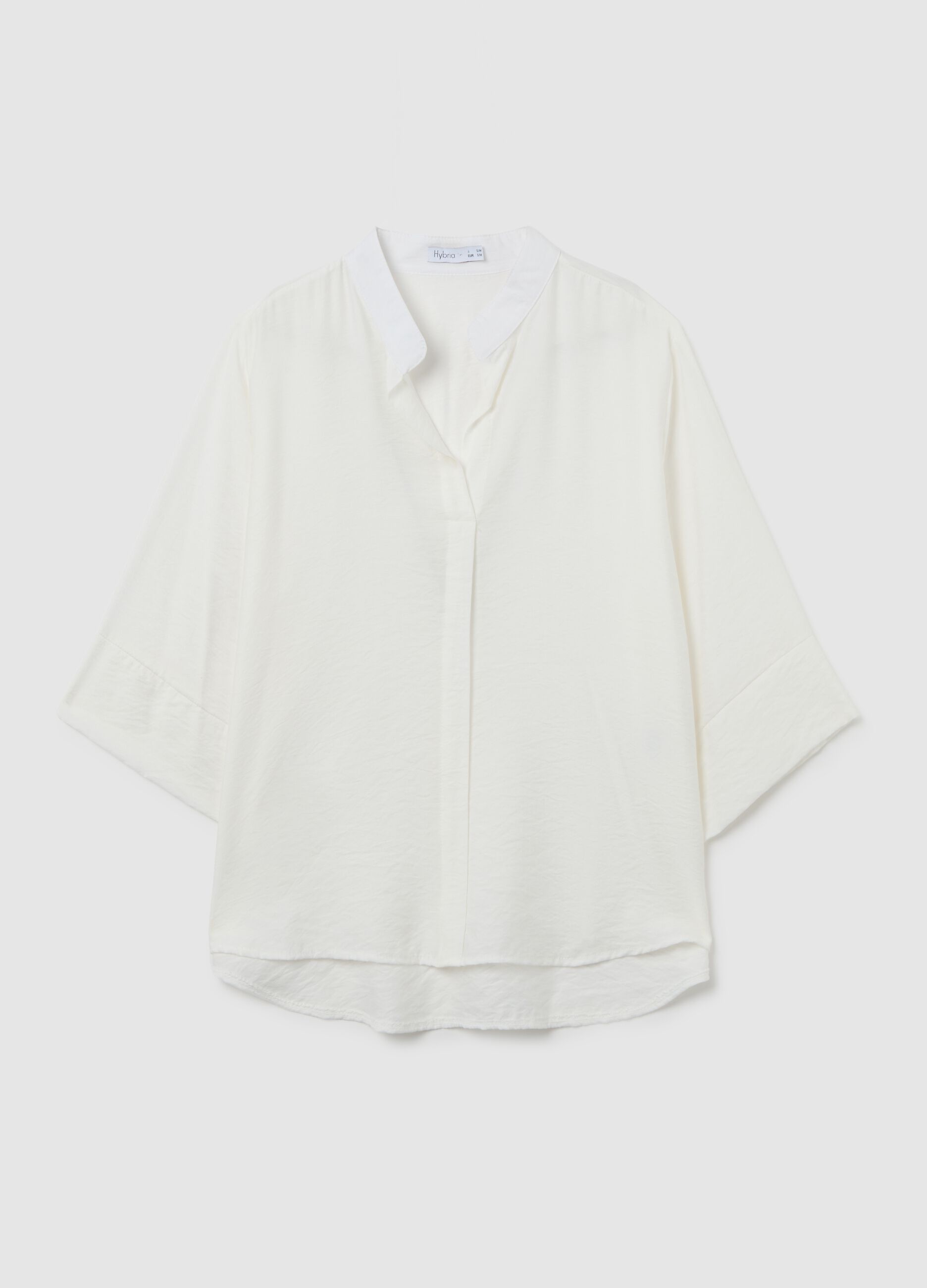 White blouse with V-neck and wide sleeves