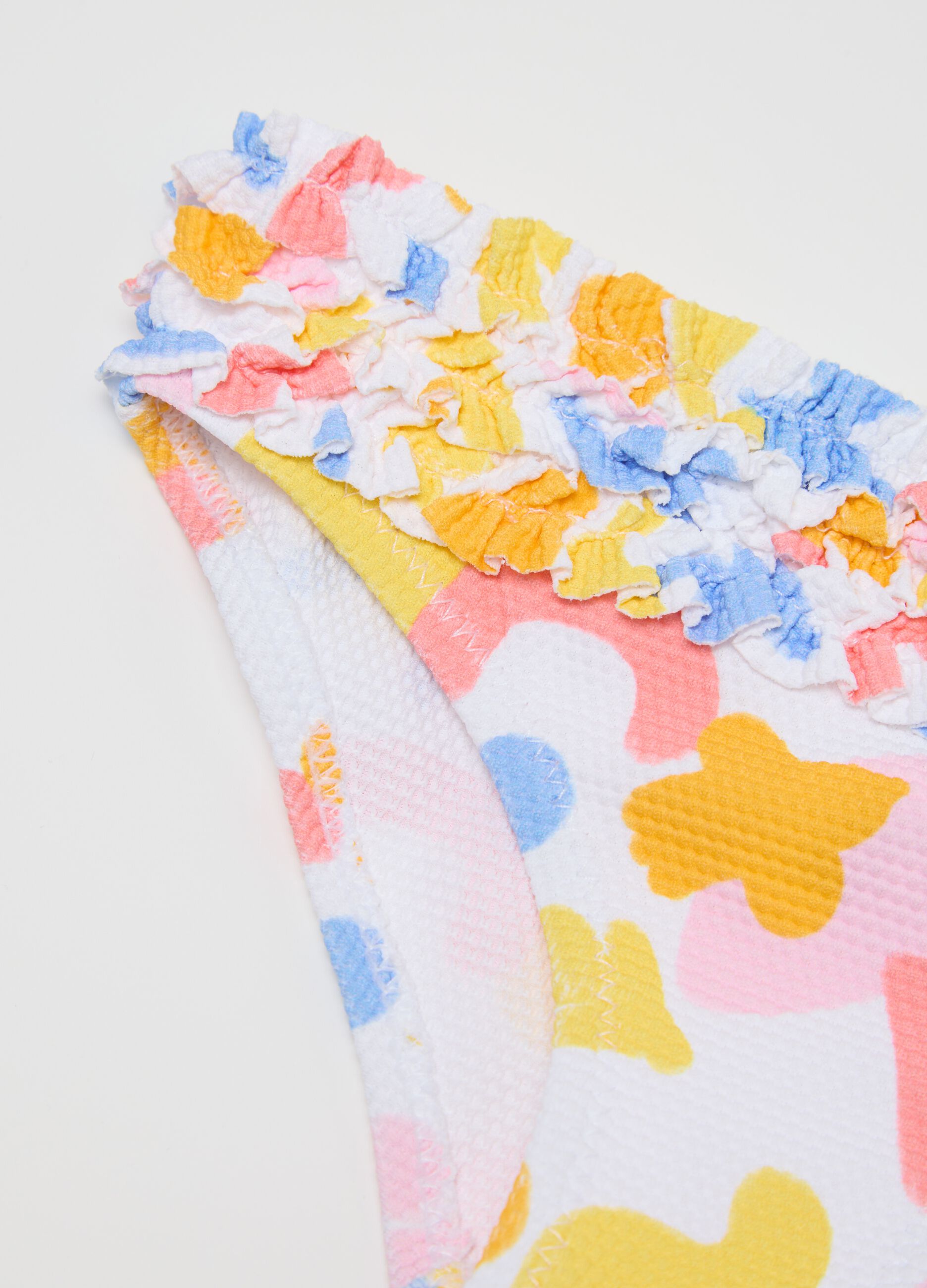Girls’ swim briefs in multicoloured stretch fabric with frill